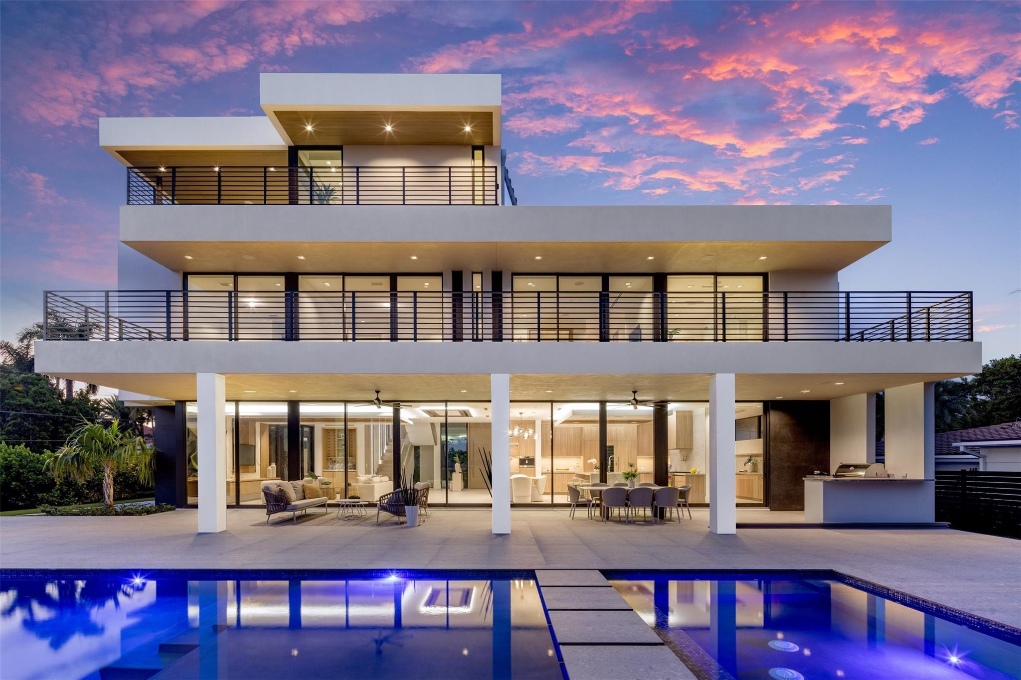 A 3-story masterpiece on a 15,500 sf lot in Fort Lauderdale's most exclusive gated beachside neighborhood. Just a short walk to the ocean and 2 miles from Las Olas shopping & dining. Designed by Tuthill Architecture redefining coastal sophistication w/ sleek designs, floor to ceiling glass windows & doors. Over 9,000 sf of outdoor and indoor living space, a 3rd-floor sky lounge with indoor/outdoor kitchen, 1/2 bathroom overlooking Lake Sylvia and the downtown Fort Lauderdale skyline. The floorplan embraces a seamless indoor-outdoor transition from every floor. A private elevator provides easy access to every level. Join the affordable Harbor Beach Surf Club, offering 300 feet of private beach access - Deepwater Marina in community with boat slips available to rent (ask for availability).