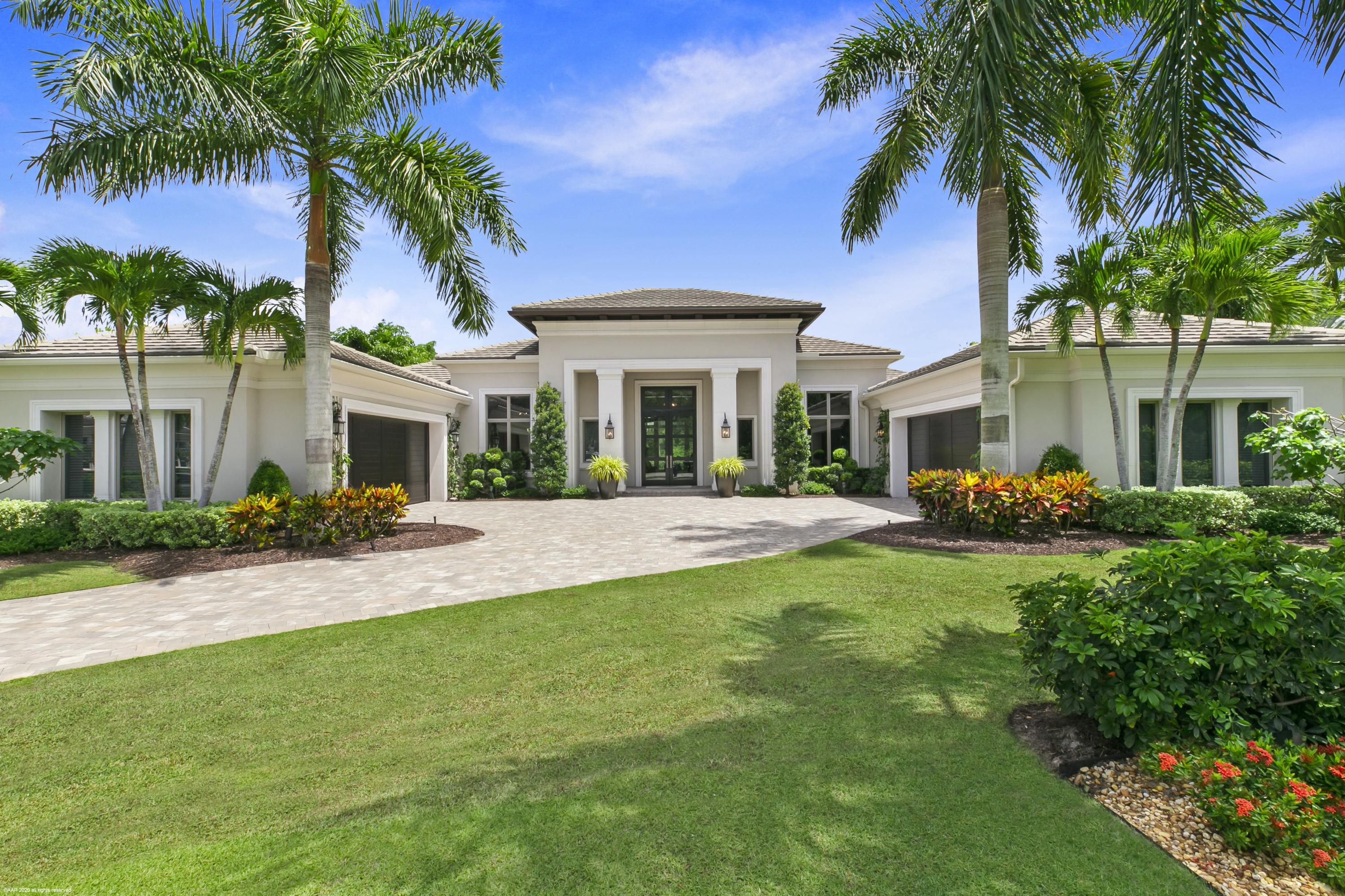 Beautifully designed Savoy floor plan on desirable 1/2 acre home site with stunning golf course view.  This impeccably maintained home boasts volume ceilings, marble & wood floors; large family room open to the kitchen with custom wine wall & breakfast area, the kitchen features a center island with seating, butler & walk in pantry, top of the line gas appliances, custom cabinetry & quartz tops; the handsome office has a private entrance & gardens view, the lavish master suite  includes his and her bathrooms, large walk in closets, lovely sitting area and gorgeous view of the backyard, pool & golf course.  This home is perfect for entertaining, host a dinner party in the formal dining room or gather with family & friends for a bar-be-cue on the covered lanai complete with summer kitchen & built in grill.  The custom heated pool with spa, lush tropical landscaping & stunning golf views are the perfect backdrop for any occasion.