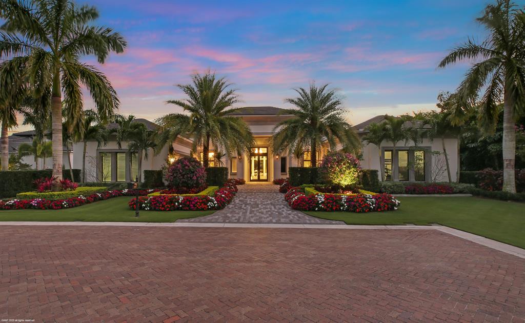 Exquisite Savoy floor plan with stunning, private water feature view on nearly 1/2 acre.  This incredible estate boasts volume ceilings, gorgeous marble and wood floors, custom wine wall, handsome office with custom built ins & glass walls; 2 beautiful powder rooms; large guest suites with private bathrooms and gracious closets; expansive master suite offering His and Her master bathrooms with views of the tropical backyard and custom pool.  The covered lanai is the perfect place to entertain and includes a summer kitchen with bbq and outdoor fireplace; soak in the spa or relax in the custom heated pool while enjoying views of paradise; the tranquil and private pavilion is the perfect setting for yoga and massage and is complete with motorized screens and outdoor heaters. The garage is designed with 4 bays plus 2 lifts to accommodate up to 6 vehicles.