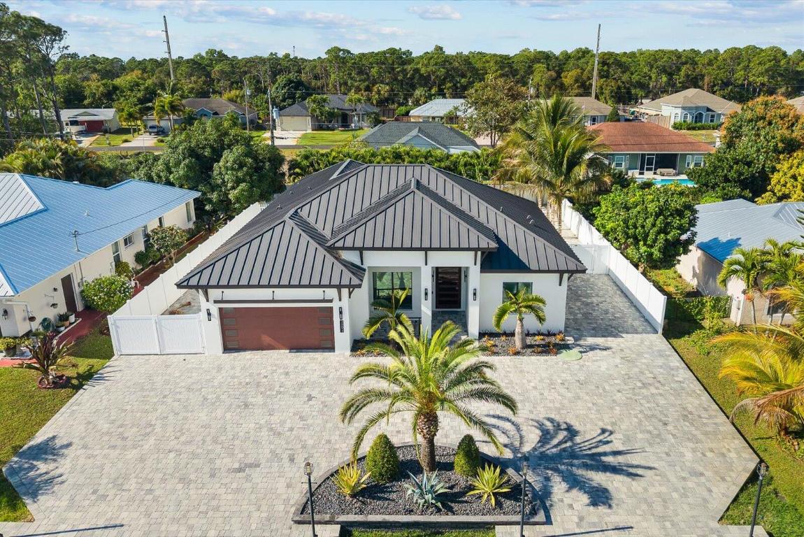 ***Spectacular Swimming Pool 4BR/4BA/2 Car Garage Home Built 2022 Upgrades Cannot Be Describe a Most See*** Located: Close to Parks, Schools, Near Tesoro, FL Turnpike, Hospitals. Features: Porcelain 48 x 48 Flooring Throughout, 12 FT Ceilings in Main, 10 Ft Ceilings M-B, 10 x 5 Ft Front Door, Open Kitchen with Quartz, Sub Zero Refrigerator, Marble Wall with Fire Place, Heated Pool with Fire Pit Burner, Fenced, RV parking, much more a must see house.