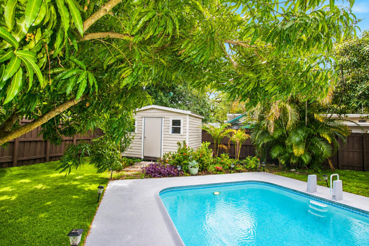 Move right into this tastefully renovated 3-bedroom, 2-bath residence located in sought-after Southwest Fort Lauderdale. Situated on an expansive homesite, the property features an extended driveway with abundant parking space. The backyard is designed for year-round enjoyment, offering complete privacy with fencing, tropical landscaping, a sparkling pool, multiple patio areas with decorative pavers, and a mature mango tree. Interior highlights include impact-resistant windows and doors, a modernized kitchen equipped with stainless steel appliances, a tankless water heater, and a installed A/C. The ext. has been refreshed with new stucco and paint, enhancing the home's attractive curb appeal. Conveniently located near major highways, shopping centers, restaurants, parks and outdoor living.