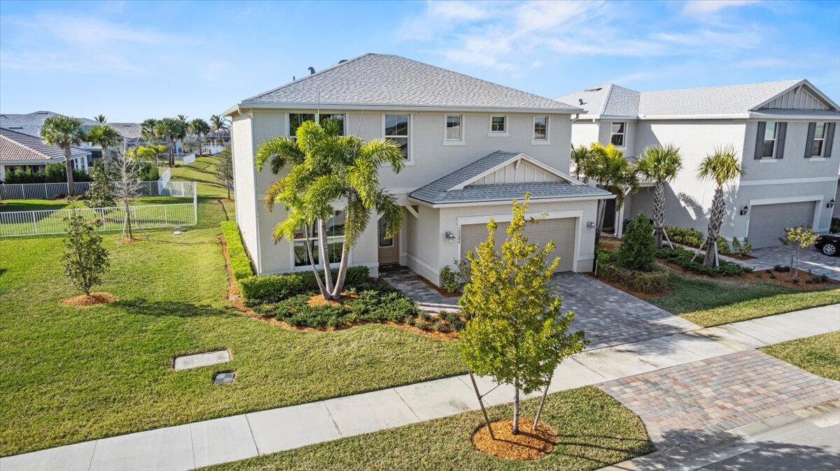 This is a beautiful builder's model, 2022 with 4 bedroom plus den, 2.5 bathrooms and 2 car garage with Impact windows. This great lakefront property is located in the very nice community of Heron Preserve. Come sit on your large covered lanai to BBQ and watch some sunsets on the long lake views. Buyer to verify all information and measurements.