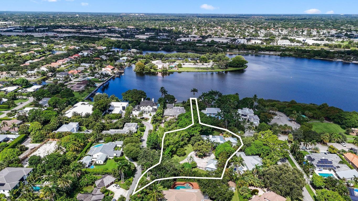 Discover unparalleled privacy and comfort in this Key West Style home nestled in the prestigious Lake Ida neighborhood of Delray Beach. This secluded retreat, surrounded by lush landscaping, offers a serene escape from the world. The home features 4 spacious bedrooms and 4.5  bathrooms, along with an office, den, and bonus room. Other features include 2022 roof and impact windows. Boating enthusiasts and lovers of waterfront living will appreciate the private dock, providing direct access to the Lake. Enjoy all that Delray Beach has to offer, from world-class dining and shopping to vibrant cultural attractions, and beautiful beaches all just minutes away.  Truly a once in a life time home. Schedule your private tour today.
