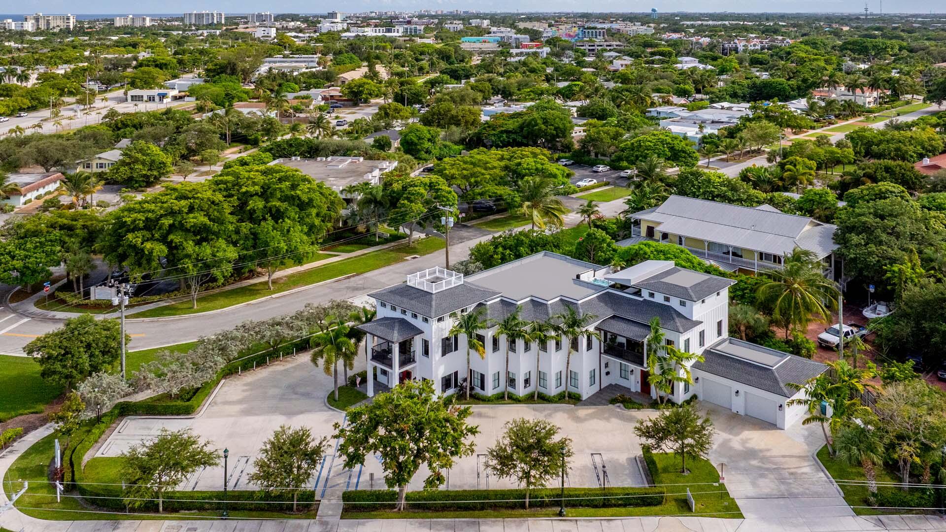 Located in the heart of East Delray Beach, this iconic mixed-use property is unlike anything else on the market. Designed as a custom three-story designer residence, the building seamlessly blends ultra-luxury living with Class A commercial possibilities, making it ideal for entrepreneurs, investors, or those seeking a statement property with income potential. Currently, the ground floor is configured as a professional medical office, while the upper levels provide expansive private living spaces. With unique zoning, the building offers maximum flexibility: " Keep it exactly as it is; luxury residential living above with commercial space below " Convert the entire building to a private luxury residence " Convert the entire building to a commercial property " Or create your own unique blend of both  Features & Amenities " Over 9,000 total square feet of interior and covered living space " Rooftop retreat with coastal breezes and full outdoor kitchen and spa, " Three oversized balconies for indoor-outdoor living " 20 Rare Downtown Parking spaces including air-conditioned two-car collector's garage plus 18 additional on-site parking spaces " Five bedrooms and overall eight bathrooms (four oversized full baths and four half baths) " Soaring 12-foot and 16-foot ceilings dramatic volume highlighted by natural gas fireplace " Downsview chef's kitchen with wine room " Private 3-story glass elevator " Oak flooring and exposed brick accents for timeless character " Whole-home automation including Savant Pro system and Lutron shades " Expansive, fenced-in turf backyard for carefree play area or dog run   Structural Integrity & Security " Nearly half-acre point lot on one of downtown's most visible locations " Impact glass throughout " Concrete block construction " Full natural gas generator " Premium finishes ensuring both durability and luxury  Location & Lifestyle Just blocks from the Atlantic Ocean and world-famous Atlantic Avenue, this property offers effortless access to Delray's best shopping, dining, and entertainment. Stroll to The Ray Hotel, the new Tiger Woods mini-golf attraction, and countless boutiques, galleries, and restaurants.  The Opportunity This rare, iconic property provides unmatched flexibility in one of South Florida's most desirable coastal cities. It presents the perfect opportunity for a hedge fund, family office, law firm, marketing agency, or to continue its current use as a premier medical office/facility. Whether kept as-is, transitioned into a full luxury residence, or reimagined as a Class A commercial building, the convenience and possibilities are truly endless.  All images and visual materials associated with this property, including AI generated images, virtually staged photos, edited images, artist conceptual renderings, maps, site plans, floor plans, and other graphics, are provided solely for illustrative purposes. These representations may not accurately reflect current conditions and are subject to change without notice. No representations or warranties are made regarding the accuracy or completeness of these visual materials. Buyers should not rely solely on these materials and are responsible for independently verifying all property details.