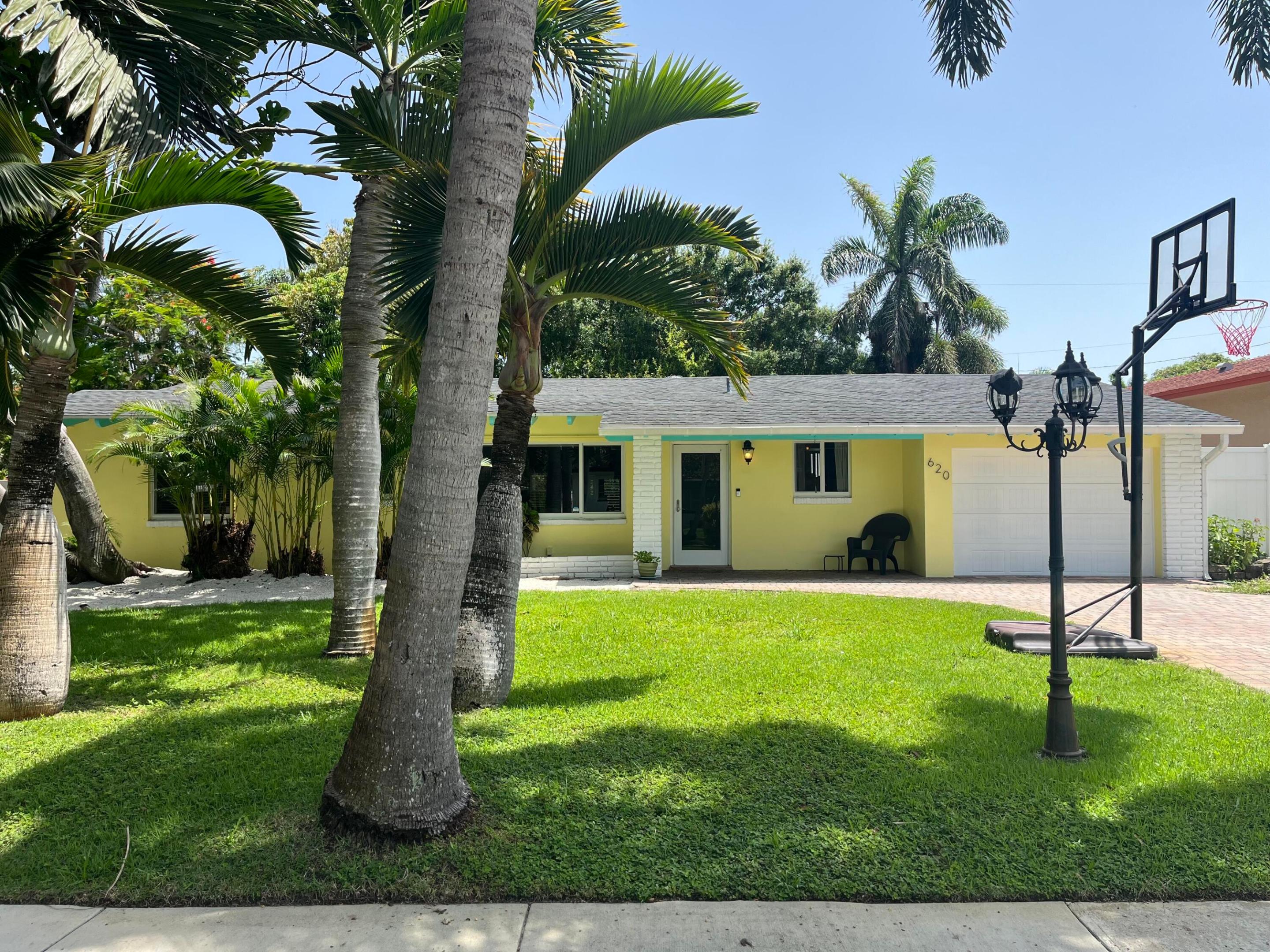 Fabulous open-concept home with split plan, attached garage, large paver driveway, huge backyard, near downtown Boynton/Delray, east of Federal Hwy/US1, near the intracoastal waters (ICW) with nearby boat ramp, multiple parks, top beaches, restaurants, shoppes all less than a mile away! Great area for biking, walking, exploring. Home has plenty of room for RV and boat trailer parking, multiple cars, motorcycles bring it all! Home has 4br, 2ba, upgraded modern bathrooms, modern kitchen, stainless-steal appliances, Spanish tile in common areas, Terrazzo floors in the family room, Porcelain in bathrooms, and tile in the bedrooms. Complete hurricane impact windows. Home has a playground, trampoline, basketball hoop, outdoor patio space with decorative pavers to bbq. NO HOA! Quick approvals!