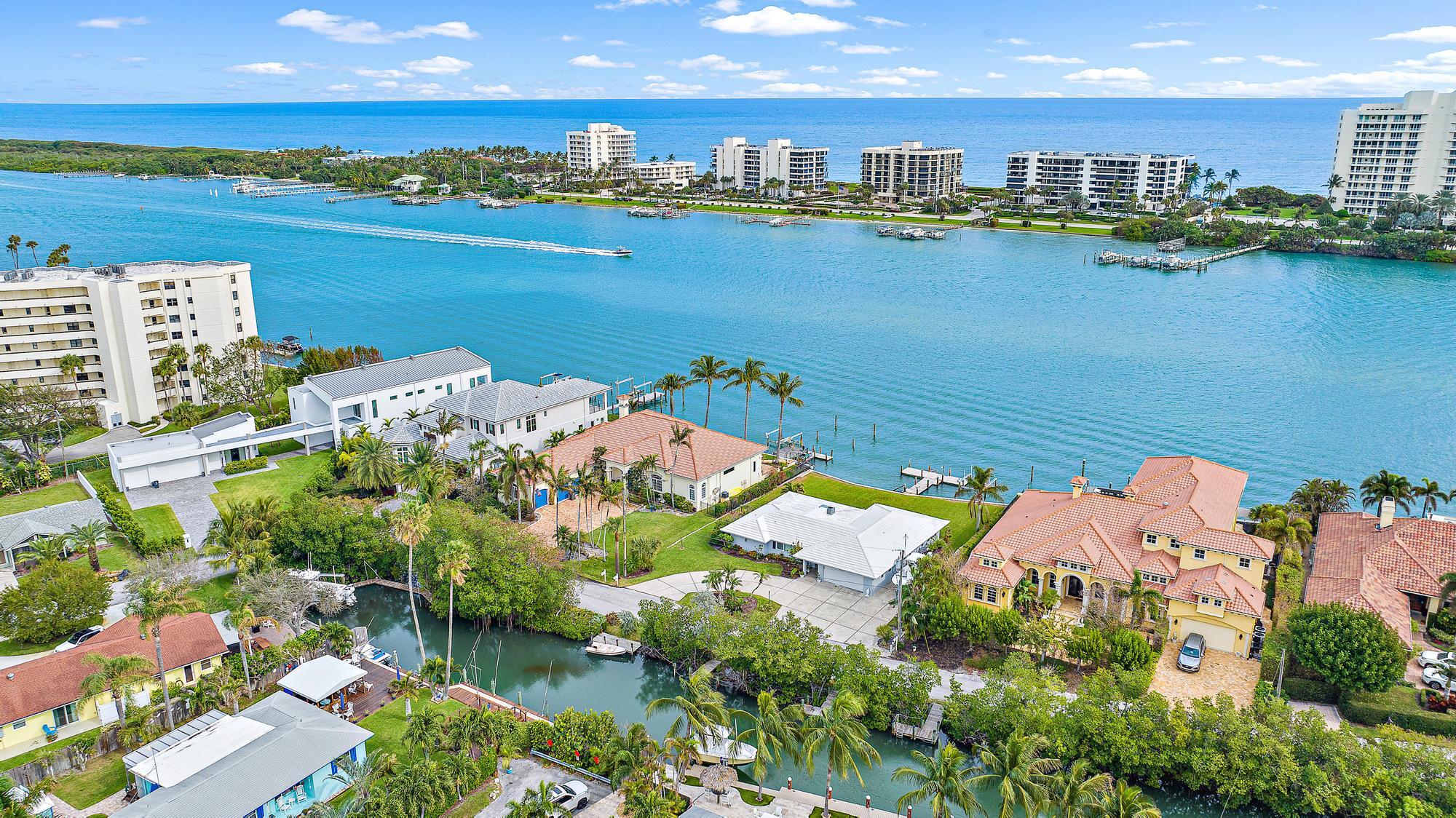 Welcome to your waterfront paradise along the tranquil Intracoastal with panoramic views of Jupiter Island. With no fixed bridges and close proximity to the Jupiter Inlet, it's a boater's dream come true. The existing home, a charming 3-bedroom 2-bathroom retreat spanning 2,226 square feet, was skillfully constructed with CBS in 1970. However, it's the land that truly steals the spotlight. Unlock the potential to create your own masterpiece on 1/3 acre with approx. 95 feet of waterfrontage. The possibilities are as endless as the water views. Imagine waking up to stunning sunrise views over Jupiter Island or enjoying an evening breeze from your own private oasis. Whether you're an avid boater or someone seeking the perfect canvas for your dream home, this property is a rare find.