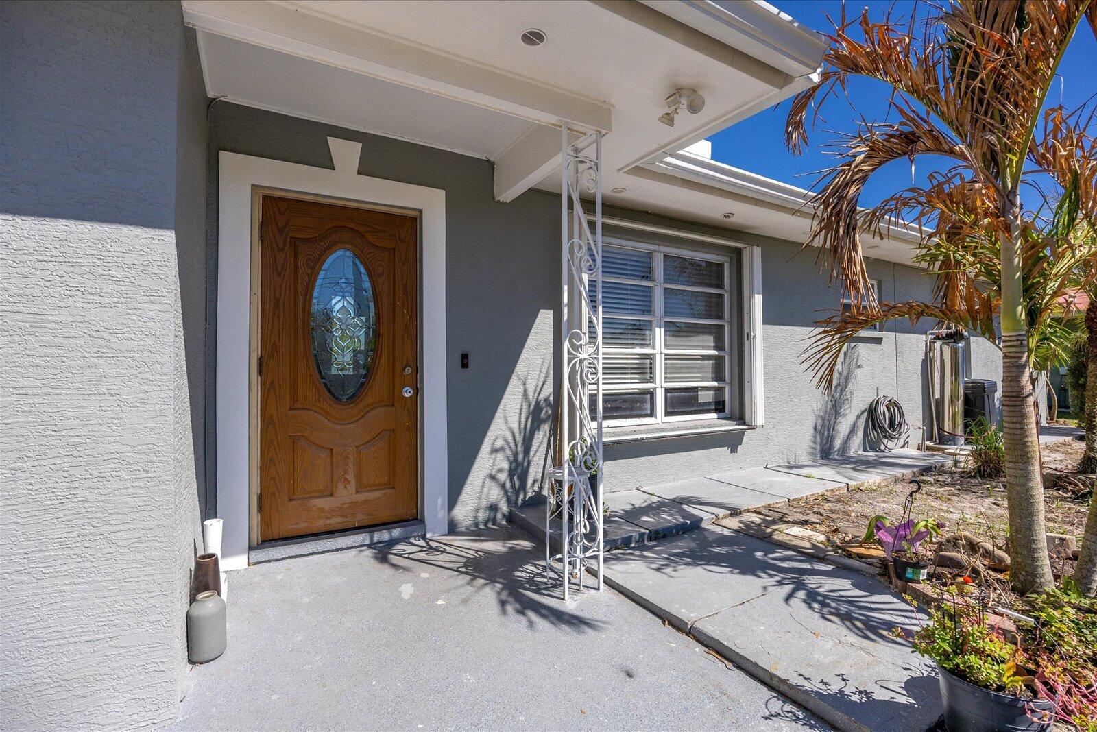 REDUCED FOR QUICK SALE!!! Thinking of moving to the sunshine State? Downsizing?  This Beautiful CBS home offers 2 bedrooms & 2 baths, plus a family room, which can be easily converted to an additional bedroom+ den. This is the the perfect combination of functionality & affordability with  enough space to be comfortable and most major repairs recently done: Roof & AC replaced in 2025, both bathrooms & kitchen have been updated, recently painted inside and out, gorgeous newer tile floors. Enjoy a 1 car garage + carport &  a  big fenced backyard with fruit trees.   Conveniently located in Port St Lucie, close to US1, Treasure coast mall, hospitals, government offices and the pristine beaches of Hutchinson about half hour away.  WATER FILTRATION SYSTEM NOT INCLUDED. OCCUPIED BUT EASY TO SHOW
