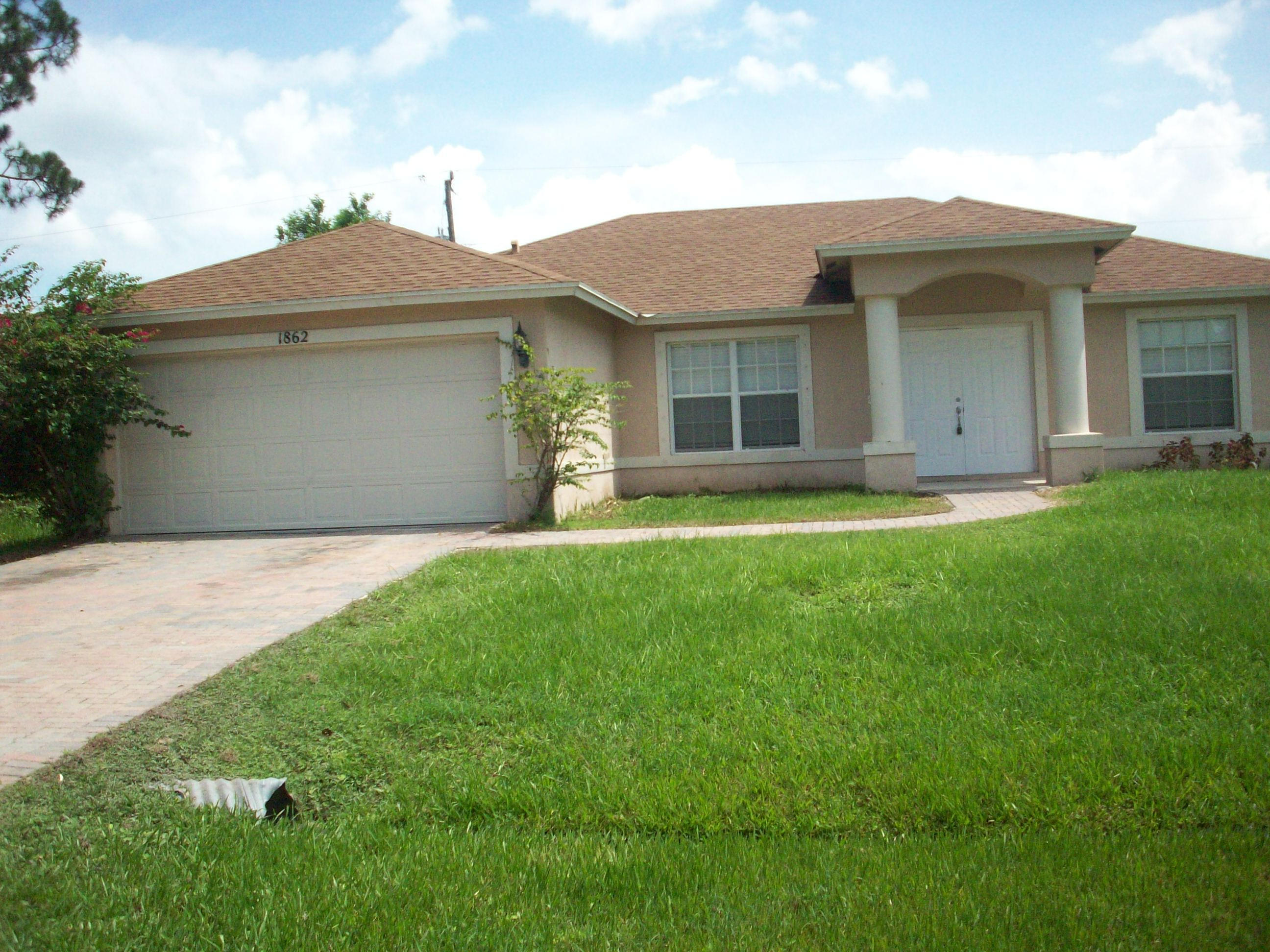 Lovely 3/2/2 all tiled floors with covered and screened back patio. Just off the patio is a covered and tiled area for BBQ. Brand new refrigerator delivered today. Fully-fenced yard with lots of space. Yard also has a mango tree.  Tenant responsible for maintaining lawn and shrubbery.