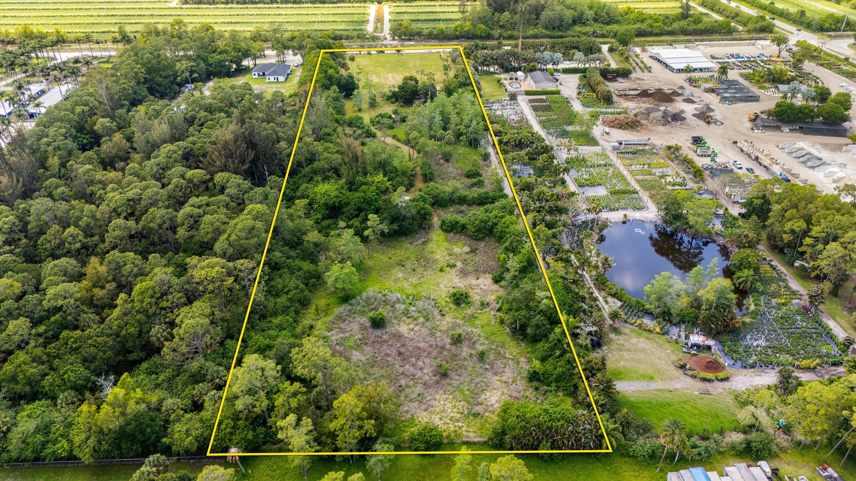Computer generated possible equestrian facilities. Situated on a sprawling 7.08-acre parcel, this unique property features a charming rustic 3-bedroom, 2-bath single-family home designed with an open-concept layout that promotes comfortable, relaxed living. The setting offers a rare blend of privacy and space while maintaining unbeatable proximity to the city.  Ideally located in Palm Beach County, you'll enjoy quick access to top destinations, including hospitals, shopping, dining, and Palm Beach International Airport. Equestrian enthusiasts will appreciate being just minutes from the renowned International Polo Club Palm Beach and the area's premier polo and riding facilities--truly the best of both worlds. This amazing lot offers ample acreage to develop barns, paddocks, arenas, or a custom equestrian estate, the possibilities are truly exceptional. The road A Road is undergoing a widening and paving upgrade.  This is definitely a rare offering that combines location (3rd lot from Okeechobee Blvd) land, and limitless potential--this is an opportunity not to be missed.