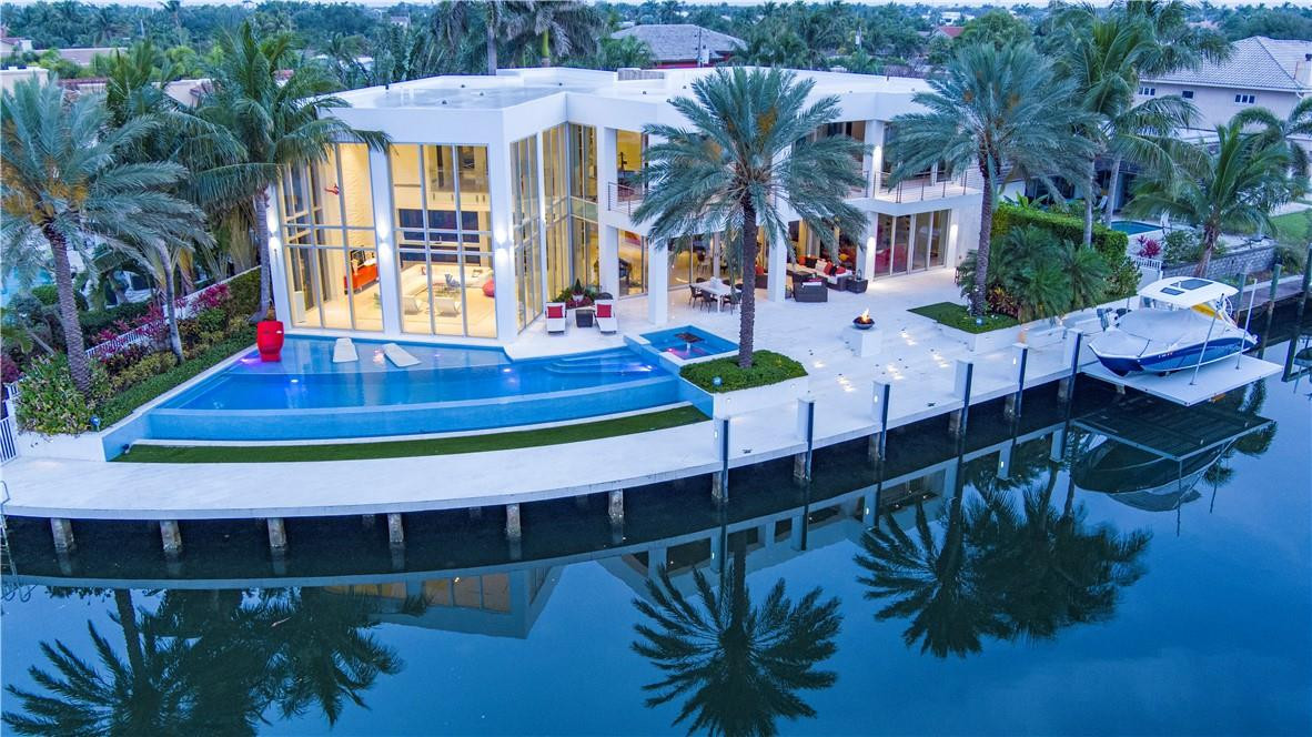 Ultra-modern furnished estate is sited on 143 +/- feet of deep water on a sought-after southeast point lot at the confluence of the San Marco Canal and North Grand Canal in Lighthouse Point. Offering incredible water views that include docked mega yachts at the Lighthouse Point Yacht Club, main rooms in this glamorous estate offer window walls of glass inviting seamless indoor/outdoor living.Shown by appt only. DISCLAIMER: Information published or otherwise provided by the listing company and its representatives including but not limited to prices, measurements, square footages, lot sizes, calculations, statistics, and videos are deemed reliable but are not guaranteed and are subject to errors, omissions or changes without notice. All such information should be independently verified by any prospective purchaser or seller. Parties should perform their own due diligence to verify such information prior to a sale or listing. Listing company expressly disclaims any warranty or representation regarding such information. Prices published are either list price, sold price, and/or last asking price. The listing company participates in the Multiple Listing Service and IDX. The properties published as listed and sold are not necessarily exclusive to listing company and may be listed or have sold with other members of the Multiple Listing Service. Transactions where listing company represented both buyers and sellers are calculated as two sales. The listing company’s marketplace is all of the following: Vero Beach, Town of Orchid, Indian River Shores, Town of Palm Beach, West Palm Beach, Manalapan Beach, Point Manalapan, Hypoluxo Island, Ocean Ridge, Gulf Stream, Delray Beach, Highland Beach, Boca Raton, East Deerfield Beach, Hillsboro Beach, Hillsboro Shores, East Pompano Beach, Lighthouse Point, Sea Ranch Lakes and Fort Lauderdale. Cooperating brokers are advised that in the event of a Buyer default, no commission will be paid to a cooperating Broker on the Deposits retained by the Seller. No commissions are paid to any cooperating broker until title passes or upon actual commencement of a lease. Some affiliations may not be applicable to certain geographic areas. If your property is currently listed with another broker, please disregard any solicitation for services. Copyright 2021 by the listing company. All Rights Reserved.
