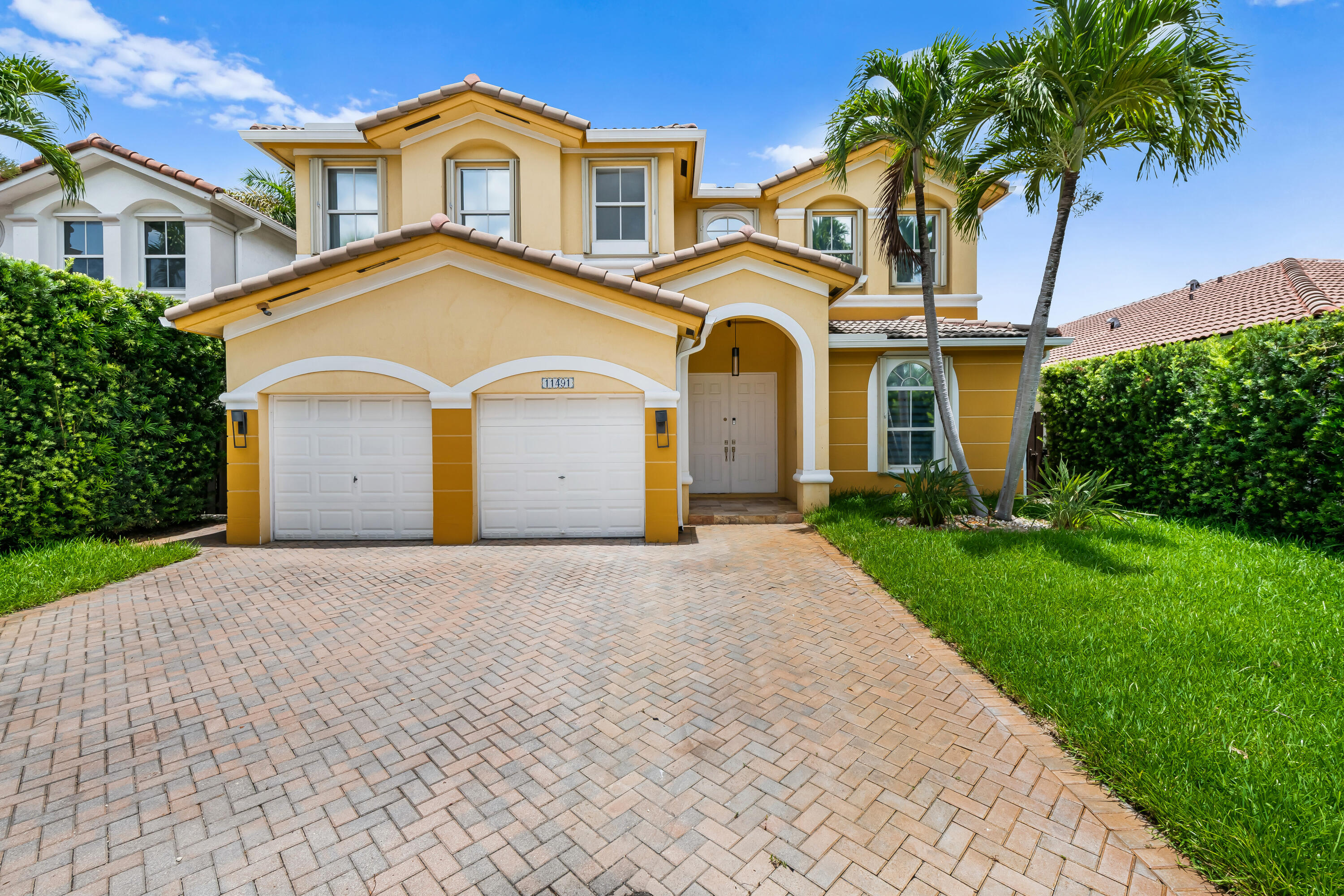 Welcome to this spacious 4-bedroom, 4-bathroom waterfront residence in the Islands at Doral. This two-story single-family home offers 3,053 square feet of sophisticated living space with a two-car garage for convenient parking and storage. It also features a convenient first floor bedroom and full bathroom. Positioned on a lakefront lot, this property provides a serene setting that enhances everyday living. The thoughtfully designed layout spans two floors, delivering ample room for modern living with 2 walk-in closets, and four full bathrooms ensuring comfort and convenience for all residents. This home represents an exceptional opportunity for those seeking an expansive home, in a great neighborhood.