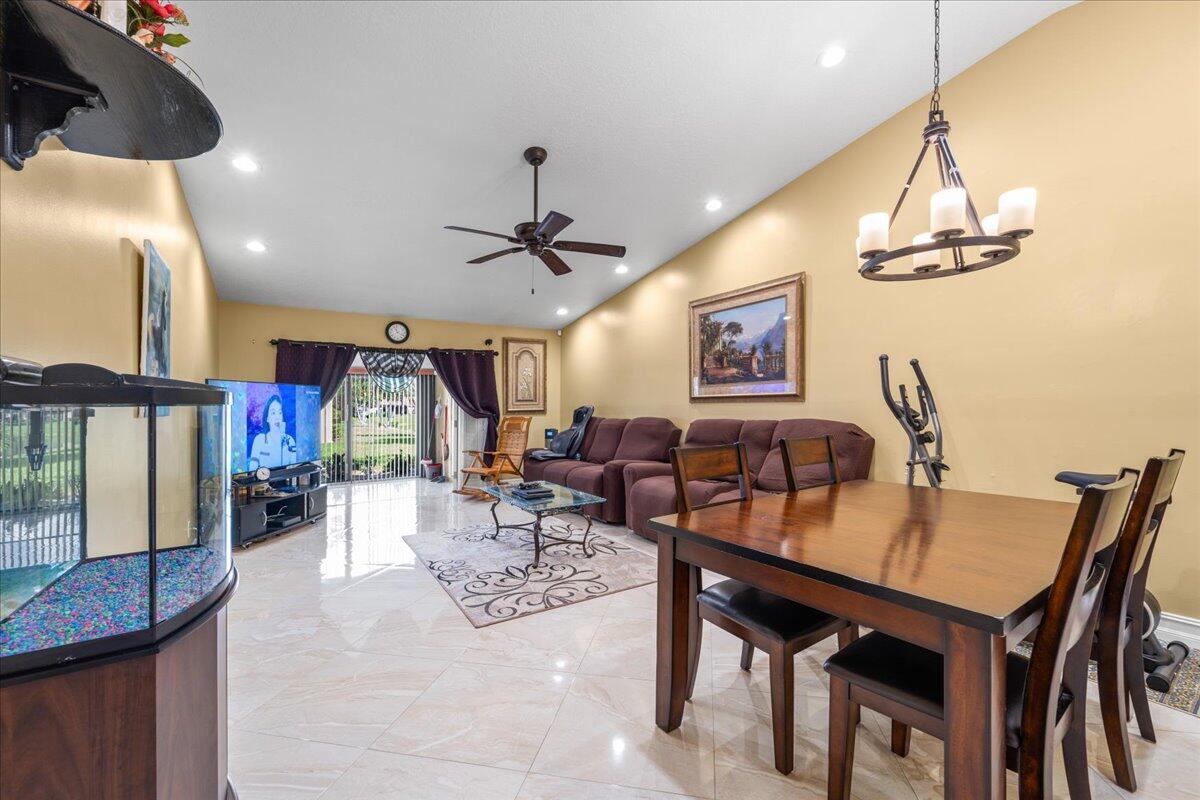 CORNER UNIT..ALL AGES VILLA. WELL MAINTAINED CORNER UNIT WITH LAKE VIEW AND RECENTLY RENOVATED. Updated Kitchen, bathrooms, Maytag stainless steel appliances, porcelain tiles throughout, tankless water heater plus complete accordion shutters. AC including condenser recently replaced with warranty. This BEAUTIFULLY WELL-KEPT VAULTED CELILING VILLA HAS IT ALL. UNLIKE OTHER VILLAS IN THE COMMUNITY. THIS LIGHT AND bright home has a large screened in patio with a separate AC unit. Also Washer and Dryer is located in a large utility room within the patio instead in the kitchen like others in the community. Everything has been TASTEFULLY UPDATED. Community offers extensive amenities including pool and tennis/pickleball. Come check this one out.
