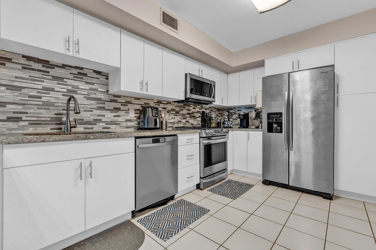 Location is everything! This 3-bedroom, 2-bath condo in Windwood is within walking distance of FAU and conveniently located near Boca Raton Middle and High School, shopping, dinning, and everyday essentials. Just 3 miles from Boca's beautiful beaches, this 1,178-square-foot home is ideal for year-round living, a seasonal  retreat, or an investment property with excellent rental potential thanks to its highly desireable location.