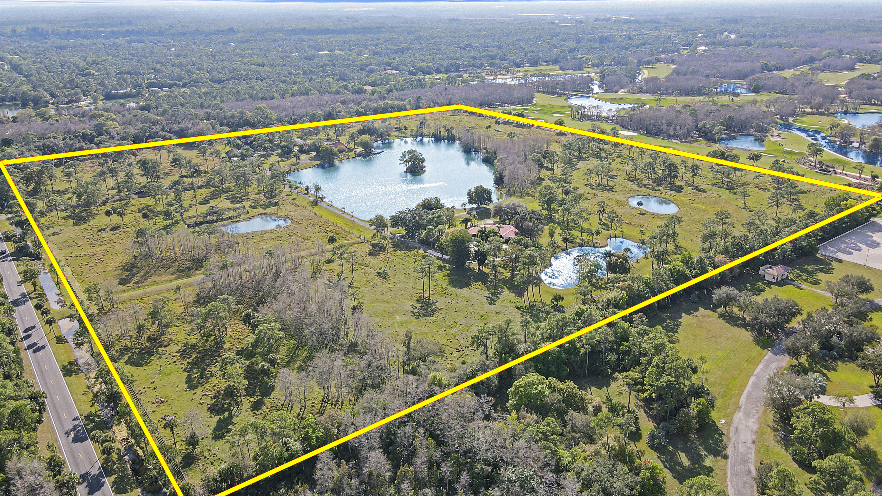 50 private acres 5 minutes from I-95, in gated Ranch Colony. Surrounded By Woods, Dye Preserve, 1 other 50 acre residence and preserve area with access to nature trails. Feels like 2 hrs from the city but it's easy access to everywhere. Property is beautiful, fenced and gated, hosts 3 homes, one, hacienda style on 30 acre parcel w a staff house & barn, the other residence on adjoining 20 acre parcel with a stocked 5 acre lake with island for zip line, canoe or fishing -centralized between the 2 domiciles. Stunning nature views and privacy.  50 acres is incredibly special in So Fl. Or subdivide.   Create your Piece/Peace of Paradise.