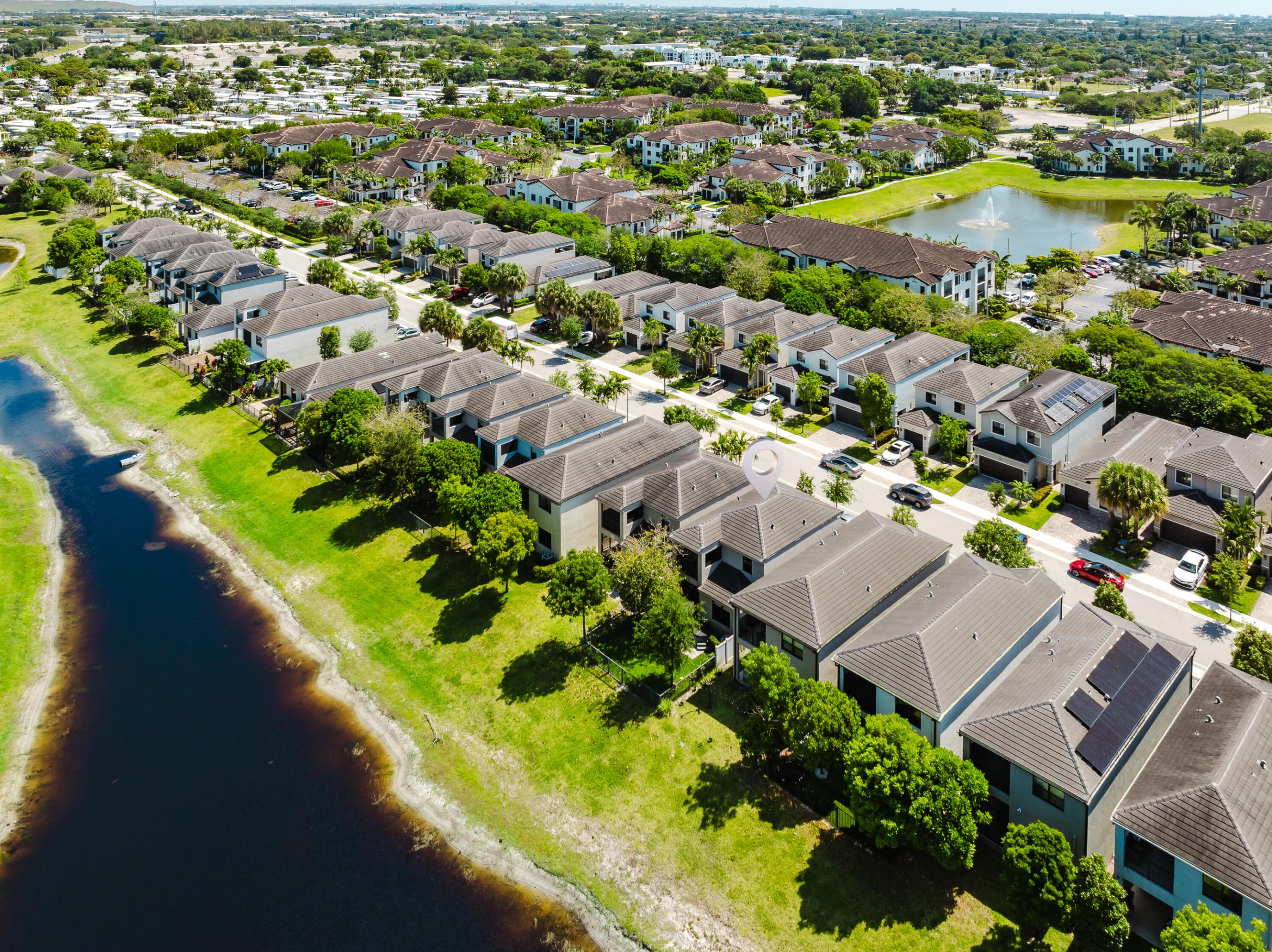 Quiet suburban gem in the gated Vantage at Palm Aire community. This 2021-built two-story home features 3 bedrooms, 2.5 bathrooms, modern high-end finishes, impact windows, a screened lanai, huge backyard w/ beautiful water views, & a gorgeous balcony off the master bedroom. Enjoy a community pool, tot lot, walking paths, and green spaces. The HOA covers landscaping, water, sewer, trash, cable, and high-speed internet. Excellent commuter location near I-95 and the Turnpike, with shopping, dining, beach, the Pompano Fisher Family Pier, & "The Pomp", a massive 223-acre mixed-use development transforming Pompano Beach with entertainment venues, dining, retail, a casino, hotels, residential towers, & offices, creating a vibrant live-work-play destination.  Low-maintenance living at its finest.