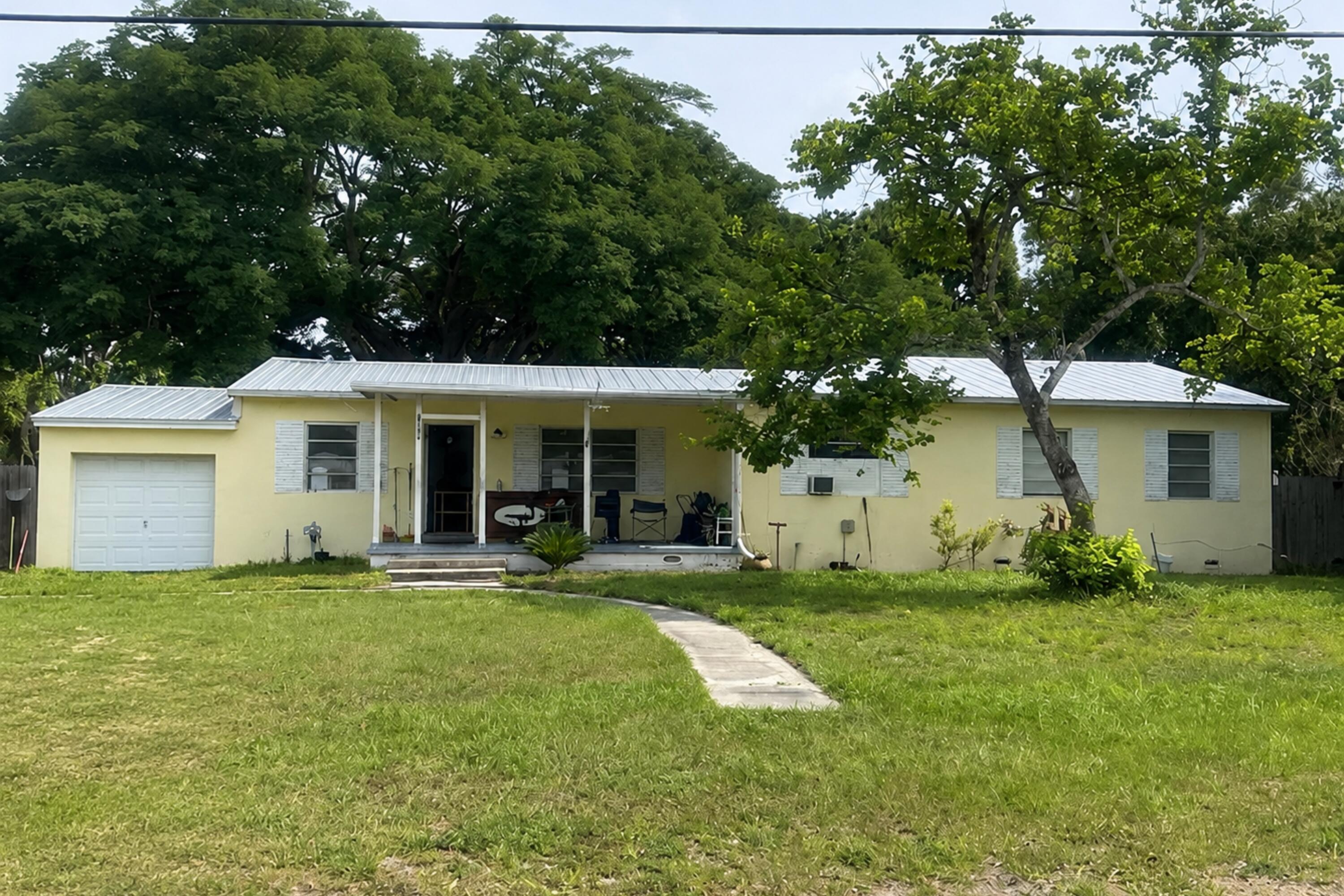 Investor opportunity in Fort Pierce! This 3-bedroom, 2-bath CBS home with a 1-car garage is ready for someone with vision to unlock its potential.This home is positioned on a generous .44 acre corner lot, plenty of room to reimagine both the home and outdoor areas. A magnificent mature oak tree adds character to the backyard.  Centrally located in Fort Pierce, approximately 2.5 miles from Lawnwood Hospital, 1.5 miles from the Botanical Gardens, and about 1 mile from US-1, with convenient access to shopping, dining, schools, and Treasure Coast beaches. A great opportunity for a fix-and-flip, rental investment, or buyer looking to renovate and create something special! Call listing agent for more photos.