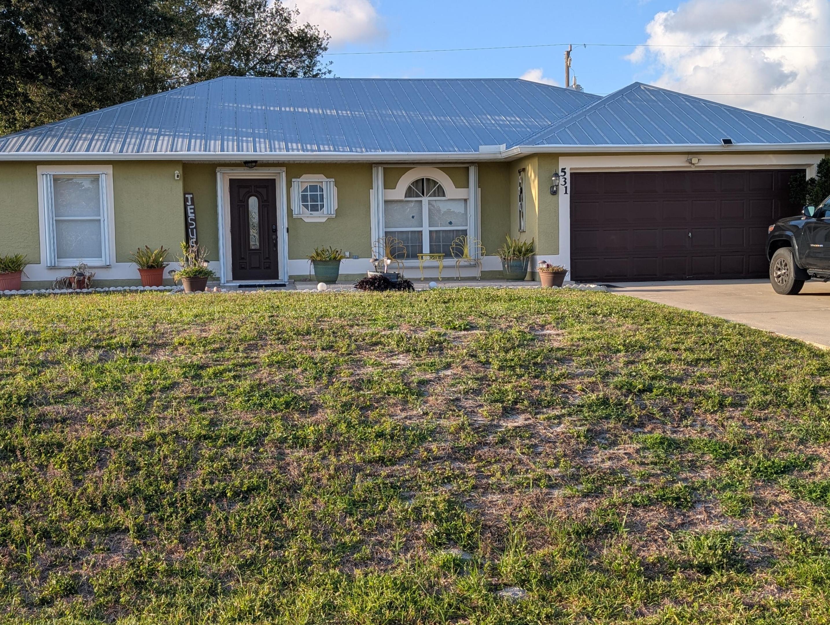 This home is located in the sought after neighborhood of Becker Ridge, a residential community, close to Turnpike and I-95.The roof was replaced in late 2017, a/c unit replaced in 2022 and the well pump was replaced  in 2025. This home is on well and septic which are both owned, thus lowering utility costs substantially. Enjoy the screened in 10 x 20 back porch with refreshing breezes.  All measurements are approximate.