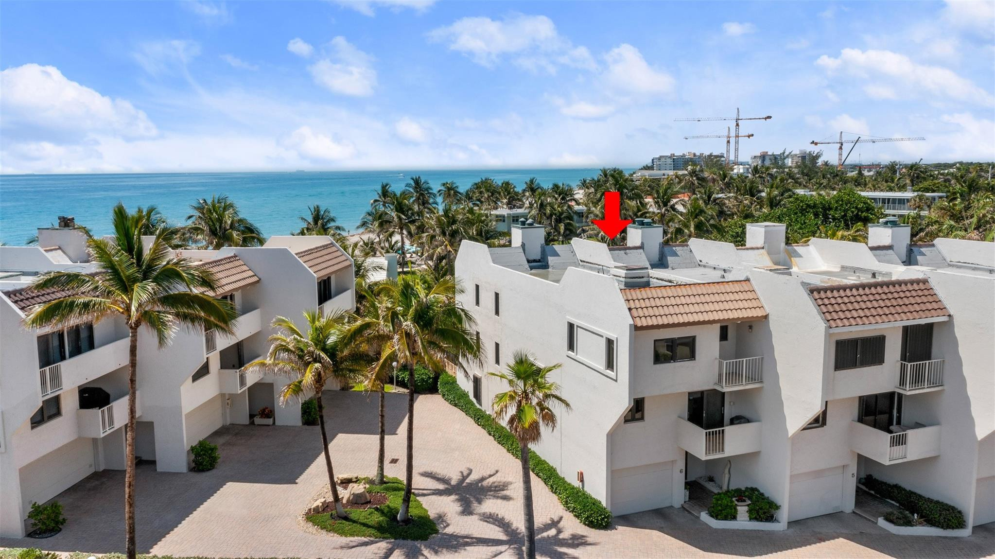 Rarely available 3BR/3.5BA townhome located in an exclusive beachfront community on Hillsboro Mile. Just steps from the sand, this spacious corner/end unit offers endless ocean views (entire side of unit faces east), a private elevator, and high-end finishes throughout. Features include: New roof, Impact windows and doors, Private in-unit elevator, Spacious open floor plan, Three en-suite bathrooms, 3 working fireplaces, Multiple balconies and a fenced backyard with an in-ground jacuzzi. Community Pool and Intracoastal Dock recently renovated! Enjoy the privacy of a townhome with the convenience of low-maintenance living. Ideal for full-time residence or vacation getaway. Prime location near shopping, dining, and marina access.