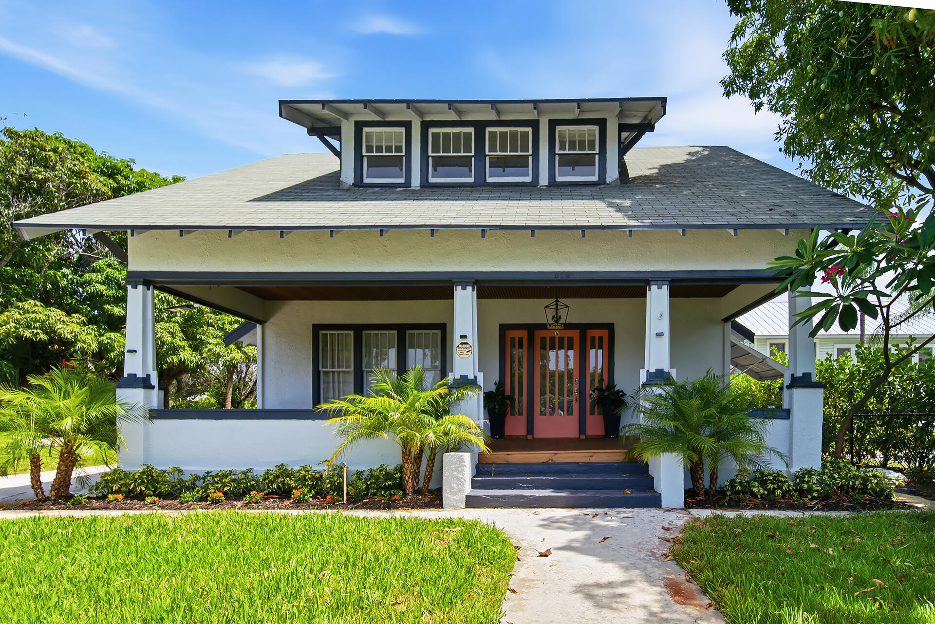 Set in the heart of West Palm Beach's historic Northwood district, this 1917 Key West-style estate sits on multiple lots just a block from the Intracoastal, with no HOA and room to expand. The main house is currently configured as two separate apartment units, plus a detached two-bedroom, one-bath apartment with its own private entrance and garage — three income-producing units in all.     Alternatively, the property can be reunited into one grand single-family estate, with the detached apartment serving as a private mother-in-law suite or guest quarters. With multiple lots and no HOA restrictions, there's also potential to build an additional home on the property, making this a rare opportunity for investors, multigenerational families, or anyone looking to create a custom compound.  You're steps from Osprey Park, Manatee Lagoon, and Rybovich Superyacht Marina, and minutes from downtown West Palm Beach, Rosemary Square, Clematis Street, and Palm Beach Island. This stretch near North Flagler is also ground zero for the city's luxury development boom, with the Ritz-Carlton Residences, Alba Palm Beach, Shorecrest, Olara West Palm Beach, the Mandarin Oriental Residences, and Apogee all rising nearby.   That wave of investments is rapidly transforming the neighborhood into one of South Florida's most closely watched waterfront corridors. It's a rare opportunity to own a piece of Northwood's history right in the path of its next chapter.