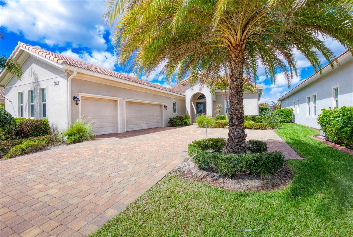 Stunning Kolter built 2020 home at Verano PGA Village. Like New home shows like a MODEL! Contemporary design features CBS Construction, Flat tile roof, paver driveway, Hurricane impact windows, tropical landscaping on a spacious lakefront lot. Hosts 3 BR's, 3.5 BA's, PLUS Flex/Office/den with custom shelves & 3 Car Garage. Foyer entrance, gorgeous luxury tile, volume ceilings & spacious open Floor Plan. Gourmet Kitchen boasts quartz countertops, Mosaic tile backsplash, stainless steel appliances, cooktop stove, wall oven & large pantry. Grand Master Suite w/ natural lighting, walk-in closet, ungraded lighting and high end finishes. Exterior features include: Flat tile roof, extended paver driveway with 3 car garage and a private saltwater pool with panoramic screen overlooking the wide lake. Outdoor living meets resort style amenities! Hurricane impact sliding glass doors lead to the covered private lanai, overlooking tropical landscaping, a sparkling saltwater pool and a serene lake. Perfect to entertain or sip a cup of coffee while watching the sunset. HOA includes: Recreation clubhouse- Club Talavera, lawn care, exterior pest control, cable, high speed internet, alarm monitoring & manned gated security. PGA Verano is a resort style community with 27 pickle ball courts, tennis courts, fitness centers with state of the art equipment, indoor and outdoor pools, saunas, and dog park. The exceptional Talavera Social Club encompasses 27,000 sq ft of entertaining bliss, which offers something for everyone! There is a golf cart path to the PGA Golf Club which offers 3 Public Championship Golf Courses and Private Course (membership optional). Located minutes from Shopping, Restaurants, Activities, Entertainment & Home to the New York Mets Spring Training. Only 45 Minutes from Palm Beach Airport and one hour thirty to the Orlando Airport. The Treasure Coast has a beautiful river and beaches, fishing & boating. PGA Verano is centrally located close to main highways, I-95 and FL turnpike. Schedule your private showing today- this beautiful move-in ready home won't last long!