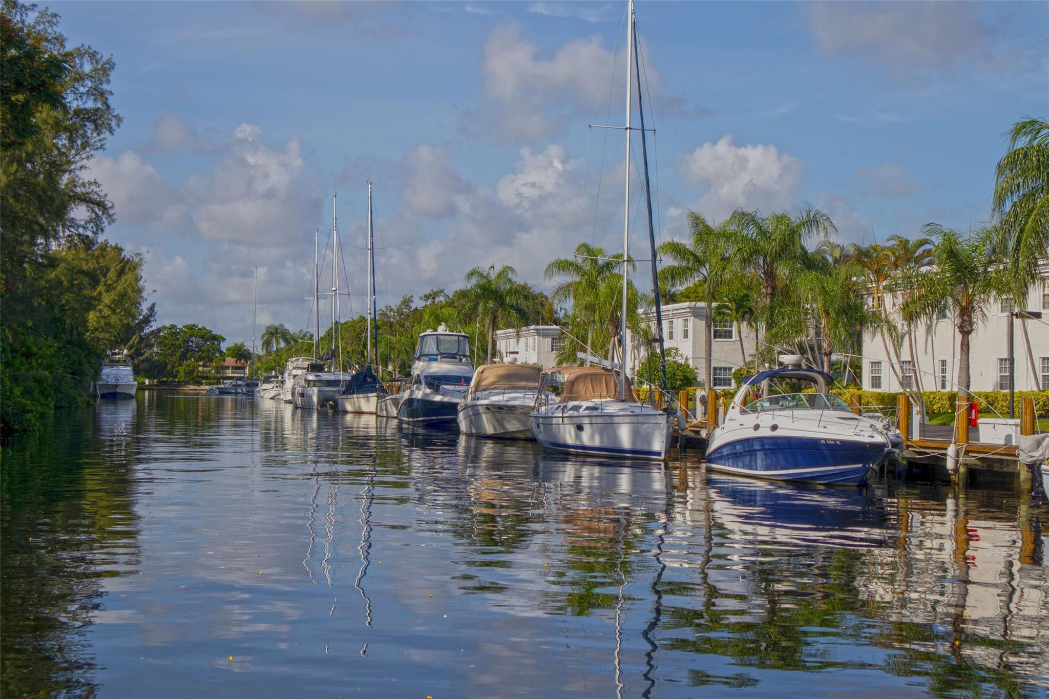 Don't miss a great opportunity to own this first floor 2 bedroom 2 full bath condo in amazing Bay Colony Club - the only GATED DEEPWATER Intracoastal community east of US1 just 2 miles from the beach & LBTS. You won't want to leave! Enclosed porch impact glass for more space, Interior closet opened for xtra storage!  Lush 30+ Acre complex offers 6 tennis courts, 2 fitness rooms, 4 heated pools (1 on the ICW with bar), bike storage, pickleball and much more. 24/7 SECURITY with gate & patrol private guards. A BOATER'S DREAM!...LOW DOCKAGE...$1.50/ft with unrestricted ocean access for your boat when available. It's all here ...a hidden gem in one amazing complex in luxurious convenient NE Fort Lauderdale. Add your own touches. DON'T WAIT! A MUST SEE!