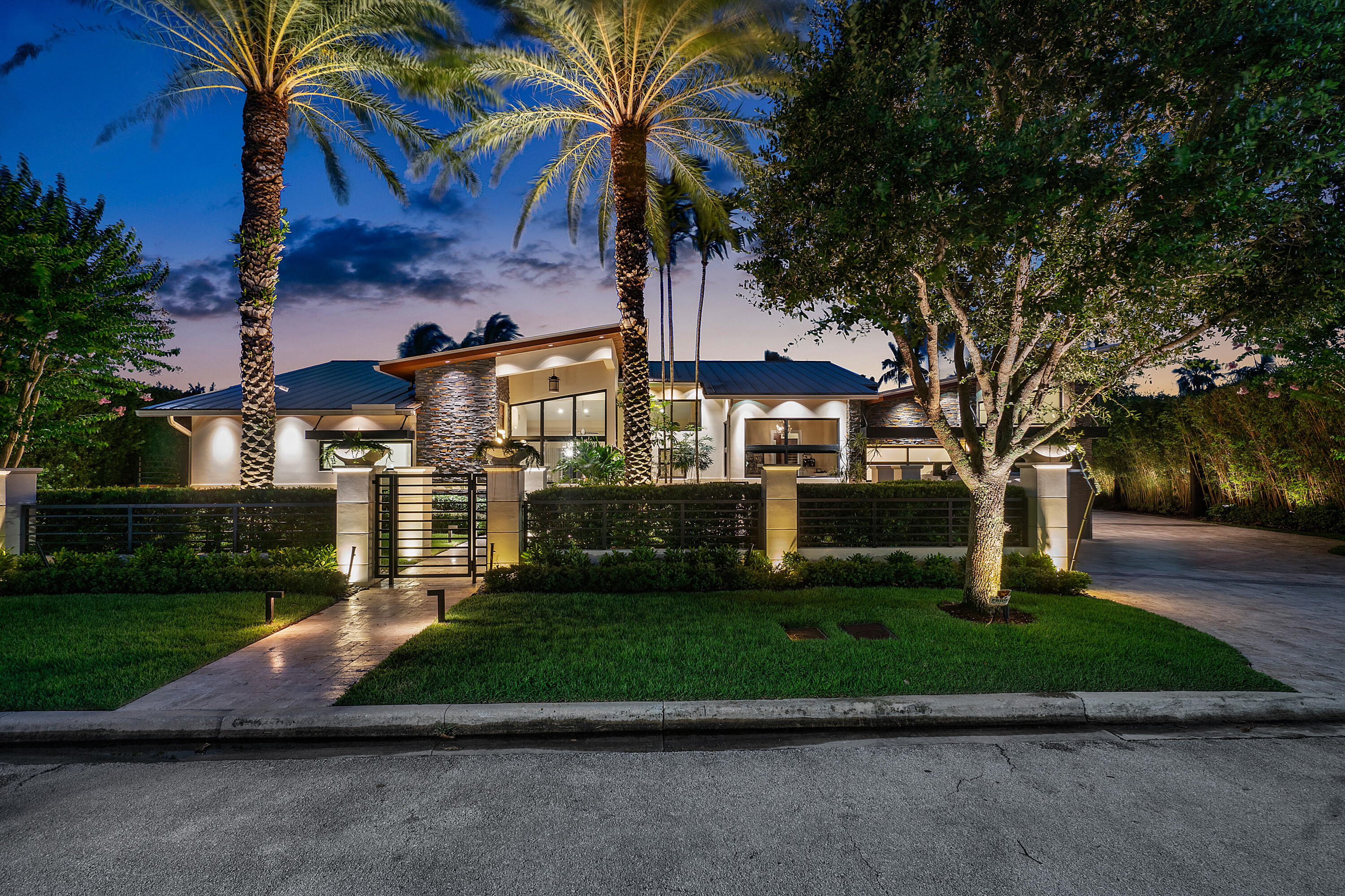 Welcome to an unparalleled paradise in Coral Ridge, where luxury meets waterfront living. This boater's dream home, designed by the award-winning Kevin Akey in 2014 and meticulously reconstructed in 2016, sits majestically on a 12,500 sq. ft. lot with 100 ft. of pristine water frontage. The exterior is a testament to sophisticated elegance, featuring a harmonious blend of stone and metal accents, crowned by a bespoke front door. Step inside to discover a world of opulence with porcelain floors that flow seamlessly throughout the living spaces, complemented by rich hardwood in the serene bedrooms. The home is adorned with imported Italian cabinets and bespoke built-ins, showcasing an exquisite level of craftsmanship. Soaring vaulted ceilings in every room amplify the sense of grandeur and space. Designed for modern luxury, the home is equipped with top-of-the-line amenities including a gas range, hot water heater, two fireplaces, a summer kitchen, and the dryer. The air-conditioned garage adds another layer of convenience with lift. Outdoors, the saltwater pool invites leisurely swims while enjoying the fully fitted outdoor kitchen.  Enveloped by lush tropical landscaping and situated on a wide canal, this extraordinary residence is the epitome of refined waterfront luxury.