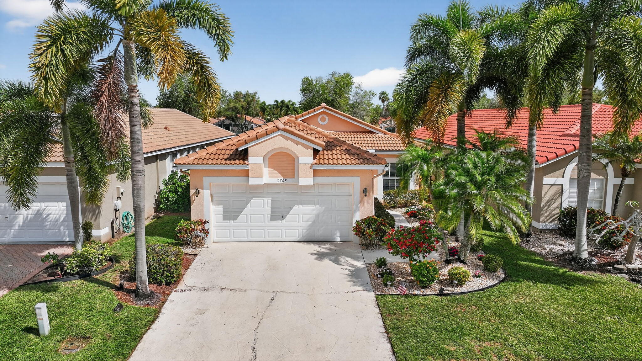 Beautiful lakefront home in the highly sought-after Adult community of The Grove in Boynton Beach. This meticulously maintained 2-bedroom, 2-bath residence with a den offers true move-in-ready living with nothing to update. The home has been completely upgraded, all installed in 2022, including a *New Roof, *New Impact Windows, *Remodeled Kitchen and Bathrooms, and high-end finishes throughout. The updated kitchen features shaker-style cabinetry, granite countertops, and modern appliances, while both bathrooms have been tastefully renovated. The spacious layout provides comfortable living with a versatile den perfect for a home office or additional guest space. Enjoy peaceful lake views from your newly screened patio with pavers extending out for more outdoor space to relax and BBQ. The community association covers full landscaping, exterior house painting, roof cleaning, and cable including HBO and Max—offering exceptional value and low-maintenance living. Located just steps away, the beautifully appointed clubhouse offers resort-style amenities including a café/restaurant, fitness center, pickleball courts, pool, spa, and more. Prime location with easy access to the Florida Turnpike and approximately 4 miles to I-95. Surrounded by abundant shopping, dining, and conveniences within 1-2 miles, and just about 5 miles to the beach or vibrant Atlantic Avenue in Delray Beach, known for its great dining, shopping, and entertainment. This is South Florida living at its best—don't miss it!