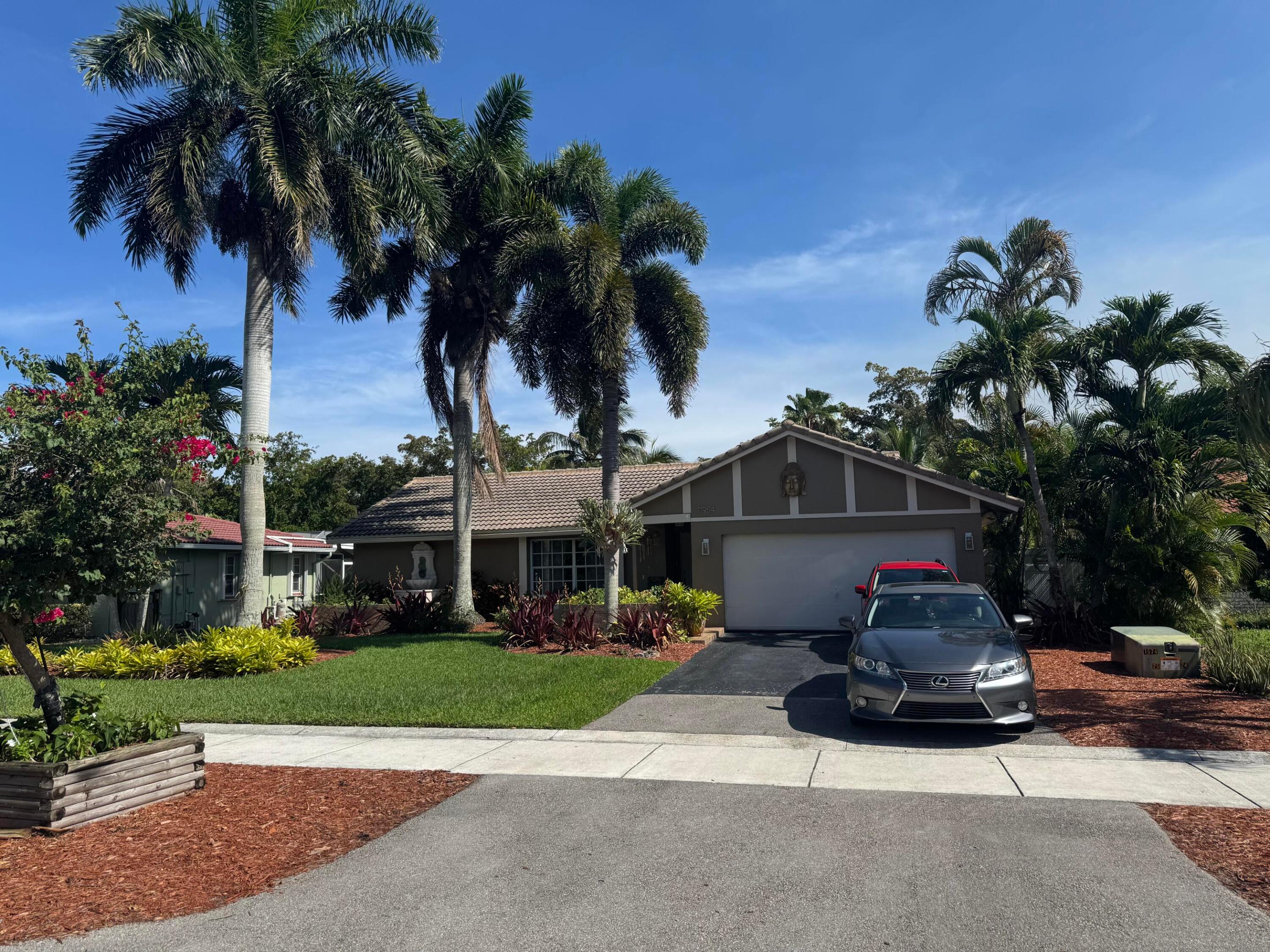 Florida living at its best! This meticulously updated home has everything on your buyers checklist, including owned Solar System, 8000W generator, new 4-ton AC & full duct system, real wood floors, LED lighting adds a warm inviting feeling throughout. Split bedroom floor plan. Large eat-in kitchen, with stainless appliances, large lsland w/Corian countertops great for entertaining Private fenced yard, walk out into your own Tropical Oasis just outside the French doors onto your screened patio. Its like going on vacation each time you step into your back yard with beautiful Palms and Fruit trees. Custom Saltwater Pool w/Fountain, Volleyball, outside Shower. Festive Tiki hut with concrete bar! Gas Grill, and a built in Fire Pit. No HOA