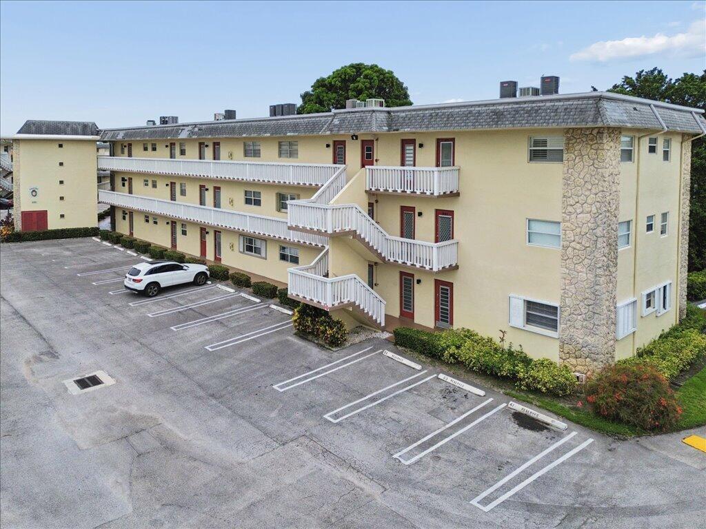 Welcome to this 2-bedroom, 2-bathroom condo in an active 55+ adult community offering comfortable, low-maintenance living with a spacious and functional floor plan. This well-kept residence features tile flooring throughout, accordion shutters, and generously sized bedrooms. Enjoy your morning coffee or unwind in the evening on the private patio overlooking beautifully maintained community landscaping and a charming gazebo area. This desirable 55+ community offers resort-style amenities, including two active clubhouses, heated swimming pools, billiards, saunas, barbecue areas, and a variety of recreational activities and social events. Additional conveniences include elevators, laundry facilities on every floor, and a welcoming community atmosphere. Located near a golf course within walking distance, this condo provides easy access to recreation, entertainment, and everyday conveniences. Whether you are looking for a seasonal residence or a full-time home, this property offers the opportunity to enjoy an active adult lifestyle in a convenient location.