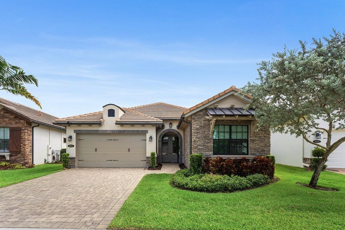 Welcome to 9131 Grand Prix Lane, a beautifully upgraded residence built in 2019 and located within the exclusive, luxury gated community of Palm Meadows Estates in Boynton Beach. Situated on one of the community's larger premium homesites, this elegant one-story home offers rare backyard privacy, tranquil water views, and over $75,000 in upgrades and improvements, including a 22KVA whole-house Generac generator with capacity to support electric vehicle charging, natural gas service including outdoor hook-up for a future summer kitchen, whole-house water filtration and softener system, whole-home air purification system, designer-upgraded primary bathroom, and an extended screened lanai. This 3-bedroom, 2.5-bath home features a desirable split-bedroom floor plan, soaring ceilings, an impressive foyer, and abundant natural light throughout the open-concept living spaces. The chef's kitchen offers upgraded cabinetry, stainless steel appliances, including a double oven, a large center island, and an oversized walk-in pantry. The oversized homesite provides ample room for a custom pool. At the same time, residents enjoy Palm Meadows Estates' resort-style amenities, including an impressive clubhouse, fitness center, tennis and pickleball courts, and an Olympic-sized swimming pool.