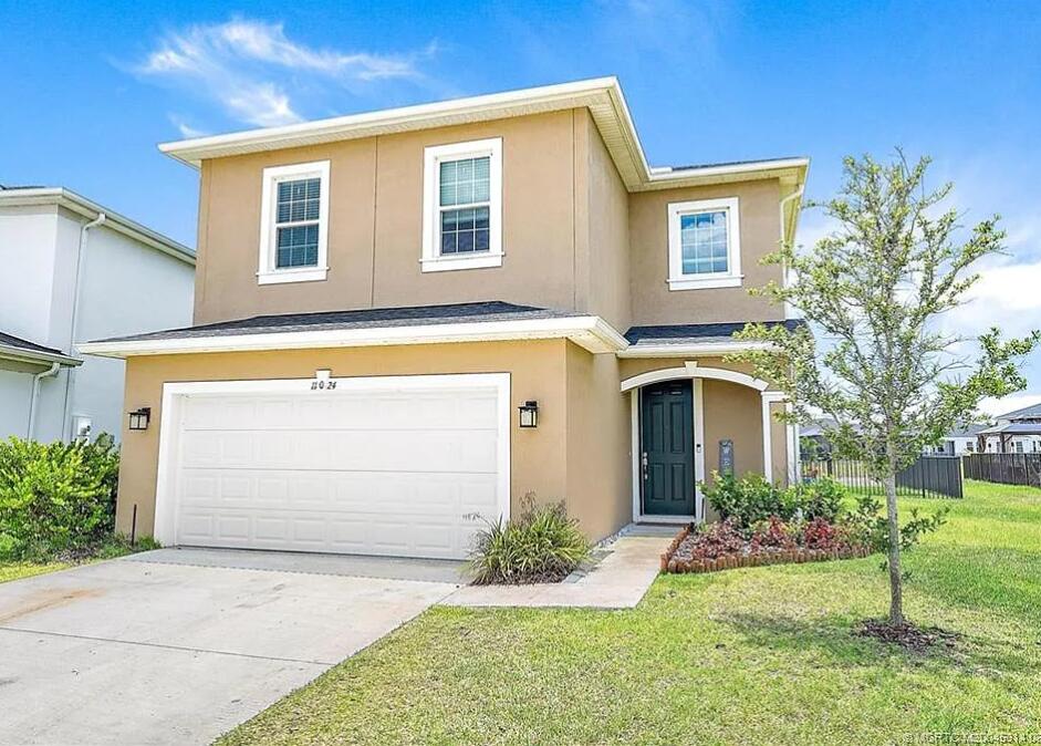 Beautiful lakeside home in Crosstown Commons offering 5 bedrooms, 3.5 baths, a loft, second-floor laundry, and a 2-car garage in a low HOA community.   Open-concept floor plan with scenic lake views, ideal for living and entertaining. Features include impact glass, plantation shutters, granite countertops, stainless steel appliances, a first-floor bedroom offers flexibility for guests or multi-generational living, and a fully fenced backyard over looking lake.   Conveniently located near shopping, dining, golf courses, and I-95. Move-in ready. Home qualifies for down payment assistance programs. Seller offering up to $10,000 in sellers' concessions.