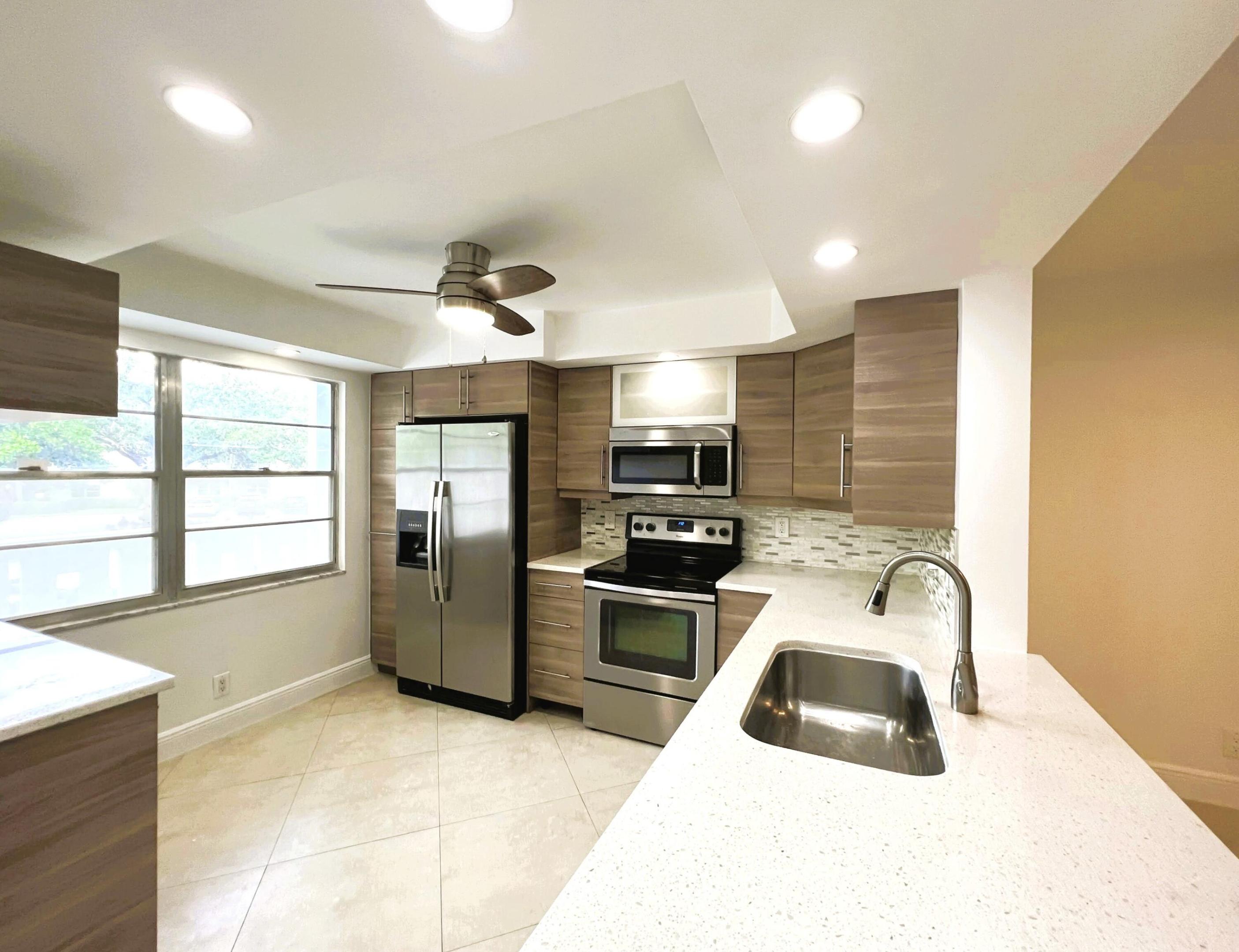 2nd FLOOR with SMOOTH CEILINGS and TILE ON A DIAGONAL THRU-OUT Plus an OPEN STYLE REMODELED KITCHEN Including STAINLESS STEEL APPLIANCES, Granite and HIGH-HAT LIGHTING and REMODELED BATHROOMS Including Granite and JET TUB. Enjoy the Luscious POOL VIEW from the Screened Patio with ROLL-UP HURRICANE SHUTTERS. Louver Windows on the Front Door and Modern Ceiling Fans for those Breezy Days. ASSOCIATION REQUIRES ONE OCCUPANT 55+ WITH 20% DOWN AND WYNMOOR INCOME FORMULA AND A CREDIT SCORE OF 700 PLUS $500 REFUNDABLE MOVE-IN FEE. Information Deemed Reliable but, Not Guaranteed.