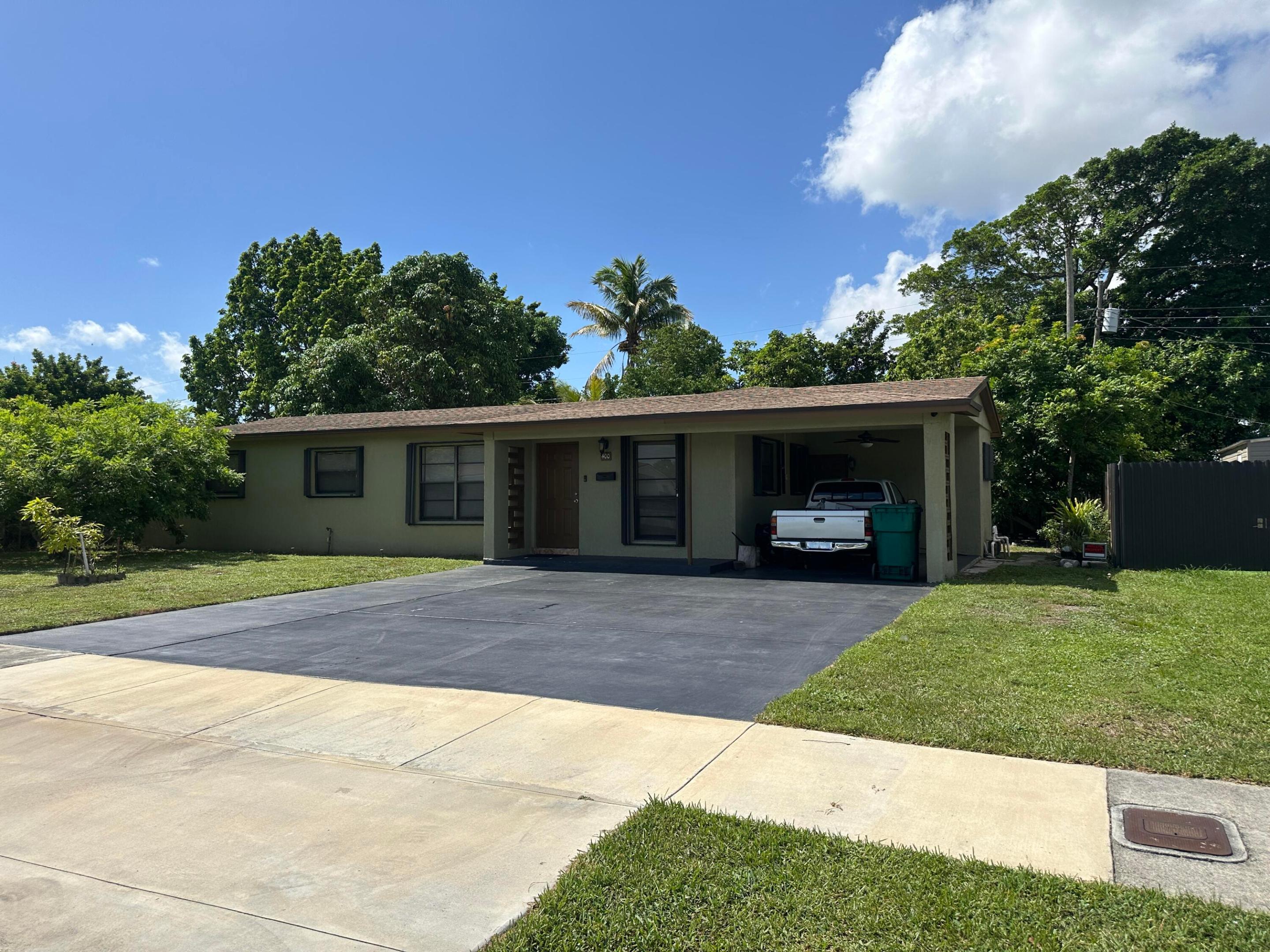Welcome to this 3-bedroom, 2-bathroom single-story residence located in Green Ranch Homes in Miami Gardens. Features, tile floors throughout, remodeled kitchen and bathrooms, Hurricane Accordian Shutters on all the windows. Private backyard with lots of fruit trees. This thoughtfully designed home offers 1,291 square feet of finished living space, providing efficient and comfortable accommodation. The single-story layout eliminates stairs and offers convenient, all-on-one-level living. Situated in the established Norland community, this property presents a practical opportunity for those seeking a compact yet functional residence in the Miami Gardens area.