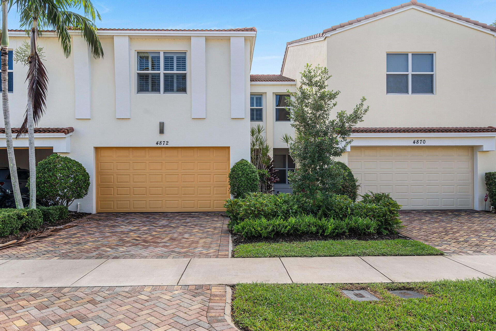 Discover elegance in this captivating two-story townhome nestled within the meticulously landscaped gated community of Centra in centrally located Boca Raton. Flooded with natural light, the home features a spacious open-concept living area and a fully enclosed backyard, perfect for privacy and relaxation. Upstairs, three generously sized bedrooms, including a master suite with a large walk-in closet, complement two full bathrooms. Parking is effortless with a two-car garage and two additional spaces conveniently situated in front.