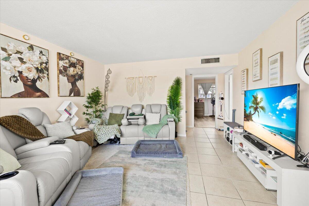 Modern unit with laminate floors in bedroom and tile in living and kitchen. White cabinets in kitchen and bathroom. Stainless appliances. Huge 5 ft X 14 ft walk in closet in extra large bedroom. Laundry on site. State of the art surveillance cameras. One parking space. This can also be rented bi-annually for $1875.00, Security, 1st and last required. 620 credit score required.