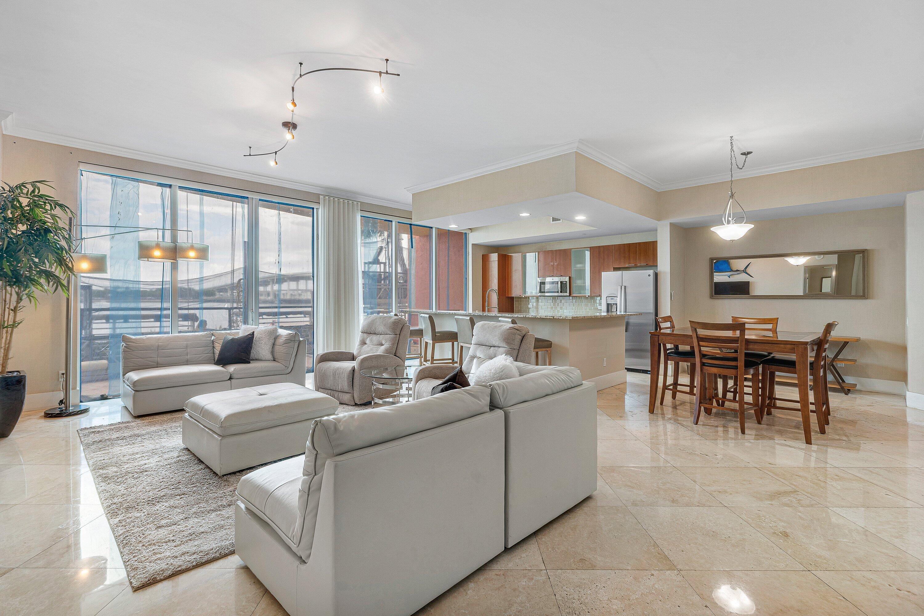 Rare ground floor end unit w high ceilings & huge patio direct panoramic view of the Intracoastal! 2 BR + den/office, 2.5 BA, offered furnished. Tile throughout, French doors. Spacious owners suite w his/her walk-in closets. Primary bath w/double vanity, jetted bath & water closet. Split floor plan, impact glass, semi-private elevator access. Sorry no pets. 24/7 manned gate, valet, new rooftop oasis w/pool, spa, BBQ areas, tennis, pickleball, bocce. Clubhouse, fitness, billiard room. assigned covered parking close to elevator, climate-controlled storage unit. Adjacent dry dock marina, no fixed bridges, minutes to ocean. Waterfront walking path w/gazebo with pet friendly walking path!