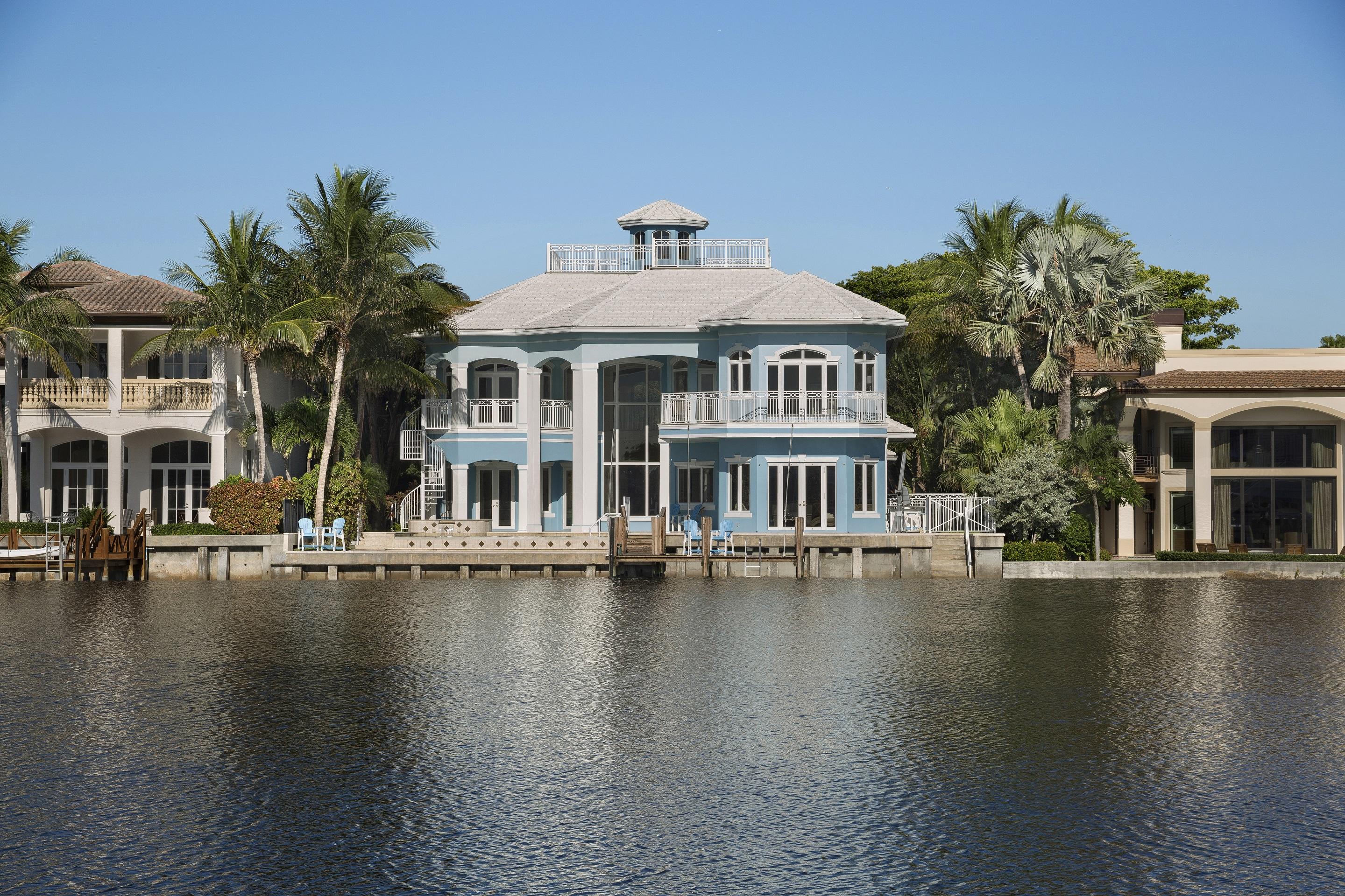 A resort-like paradise, just a few blocks from Atlantic Ave, surveying an entrancing wide waterscape, this impressive Intracoastal estate features no-wake yacht dockage. Versatile living/entertaining spaces overlook the infinity pool seeming at one with the waterway.  Dramatic sky deck.  Car collector's 5-vehicle garage with lifts.  Extremely solidly built with impact-glass, generator, elevator.
