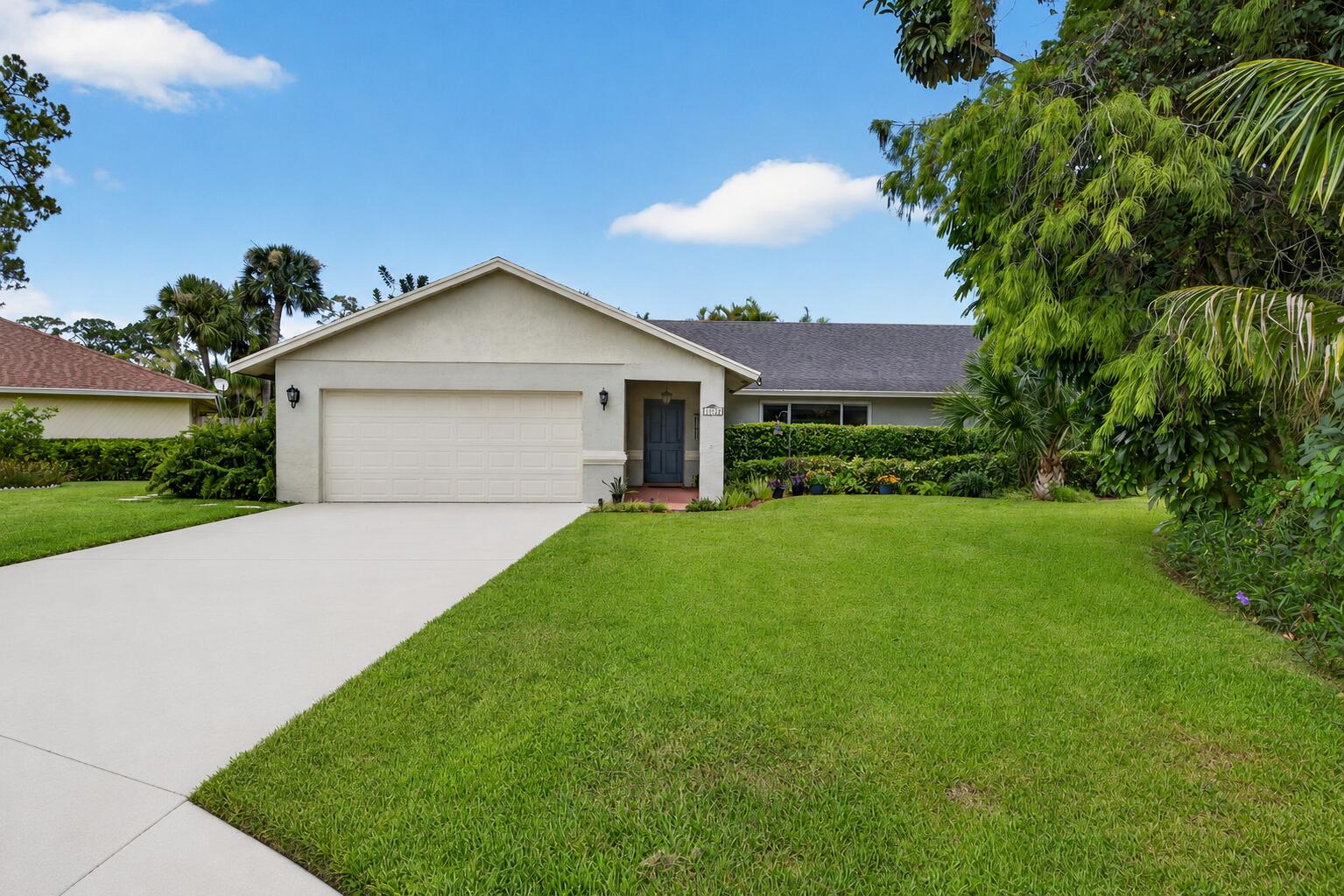 Welcome to this beautifully maintained 4-bedroom, 2-bath pool home, ideally situated on a generous .288-acre cul-de-sac lot in one of Wellington's most desirable neighborhoods with no HOA. Thoughtfully updated and meticulously cared for, this residence offers the perfect combination of comfort, functionality, and South Florida living. Step inside to a bright, open floor plan featuring neutral tile and rich wood flooring that create a warm, inviting atmosphere. The spacious kitchen is designed for both everyday living and entertaining, showcasing beautiful hickory wood cabinetry, Corian countertops, a pantry, abundant prep space, a 2024 appliance suite, and ample counter-height seating that flows seamlessly into the living and dining areas. The private primary suite serves as a peaceful  retreat, complete with a walk-in closet, an ensuite bath, and direct access to the screened patio and pool. Three additional bedrooms and a well-appointed guest bathroom are thoughtfully positioned on the opposite side of the home, providing privacy and flexibility for family members, guests, or a home office. Significant recent improvements provide exceptional value and peace of mind, including a new A/C (2025), new well pump (2025), new water heater (2026), additional attic insulation for improved energy efficiency, and hurricane-impact windows, doors, and garage door. The spacious garage also features a convenient pull-down Hollywood attic ladder leading to a floored storage area, offering plenty of extra space for seasonal items and equipment. Outside, enjoy your own private backyard oasis. The sparkling pool, outdoor shower, expansive fenced yard, and spacious patio create the perfect setting for relaxing, entertaining, or enjoying Florida's year-round sunshine. Ideally located just minutes from Wellington's top-rated schools, the International Polo Club, Wellington International, The Mall at Wellington Green, parks, dining, shopping, the community center, and Palm Beach International Airport, this exceptional home is also only about 20 minutes from South Florida's beautiful Atlantic beaches. Offering an outstanding location, extensive updates, and no HOA restrictions, this move-in-ready property is one you won't want to miss.