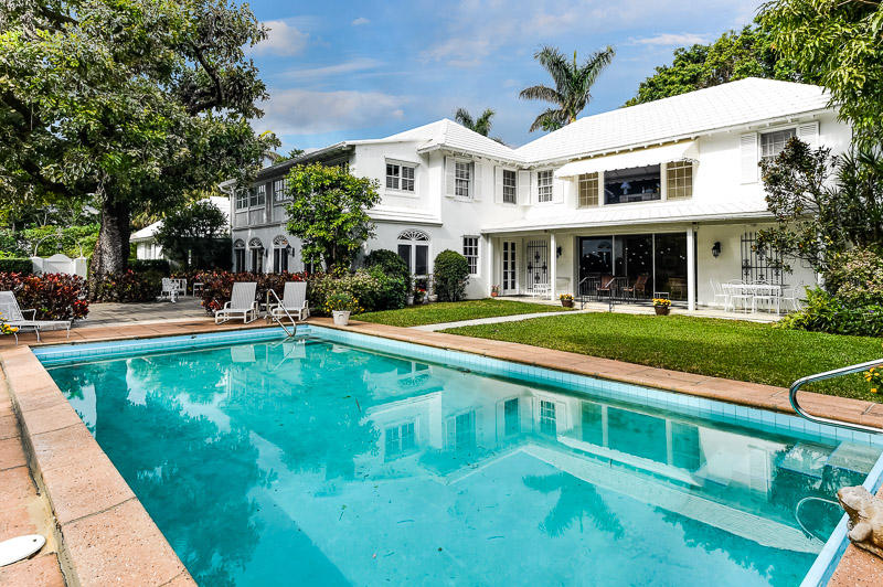 his exceptional, classic, property is located on the highly desirable Emerald Lane, which is very private and quiet-close to town, the beach and the Lake Trail. The downstairs has a formal entrance opening to a gracious large living room that leads to the separate dining room and 40 foot loggia. The doors to the loggia open to a very spacious patio with a mature tree and a pool on the side of the property. There is a paneled library with built in bookcases that leads to the updated gourmet kitchen with a center island and stainless appliances with an abundance of cabinets and storage. There is a large great room off of the kitchen overlooking the pool that has a cabana bathroom with two doors leading to a side yard. There are three bedrooms upstairs Ã¢â‚¬"each with en- suite bathrooms plus an expansive, spacious master, facing the pool, with a trey ceiling and two bathrooms.
There are two additional bedrooms, with a bathroom, off of the upstairs laundry room that have a separate entrance from the driveway. These rooms are above the 2 car garage, which has an additional laundry room and a bike storage area.
There is an alarm system and a full house generator.
The house is full of natural light, very elegant with fantastic indoor and outdoor living space! A true Palm Beach gem!