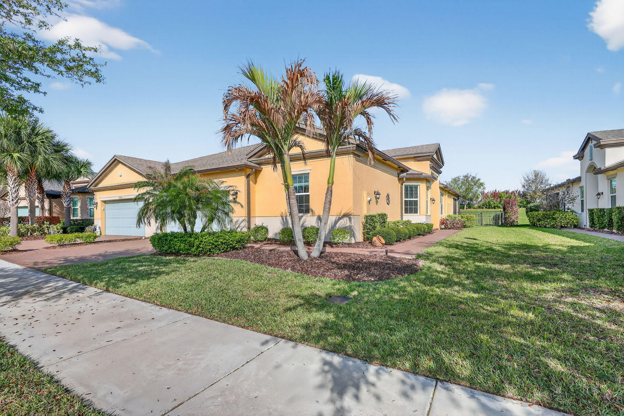 Experience low-maintenance living in LakePark at Tradition, an exclusive 55+ village in the highly desirable TownPark community. This spacious villa offers 2 bedrooms plus a study with a thoughtfully designed open layout complete with an oversized 2 car garage. An extended screened-in lanai and fenced backyard create a private outdoor retreat—ideal for entertaining, accommodating pets, or everyday enjoyment. The kitchen features a center island and generous cabinetry, opening to the main living areas. LakePark residents enjoy access to a private amenity center including a fitness center and pool, along with a dedicated dog park—plus full access to TownPark's resort-style amenities. Centrally located within Tradition—this is more than just a home; it's the lifestyle you've been waiting for!