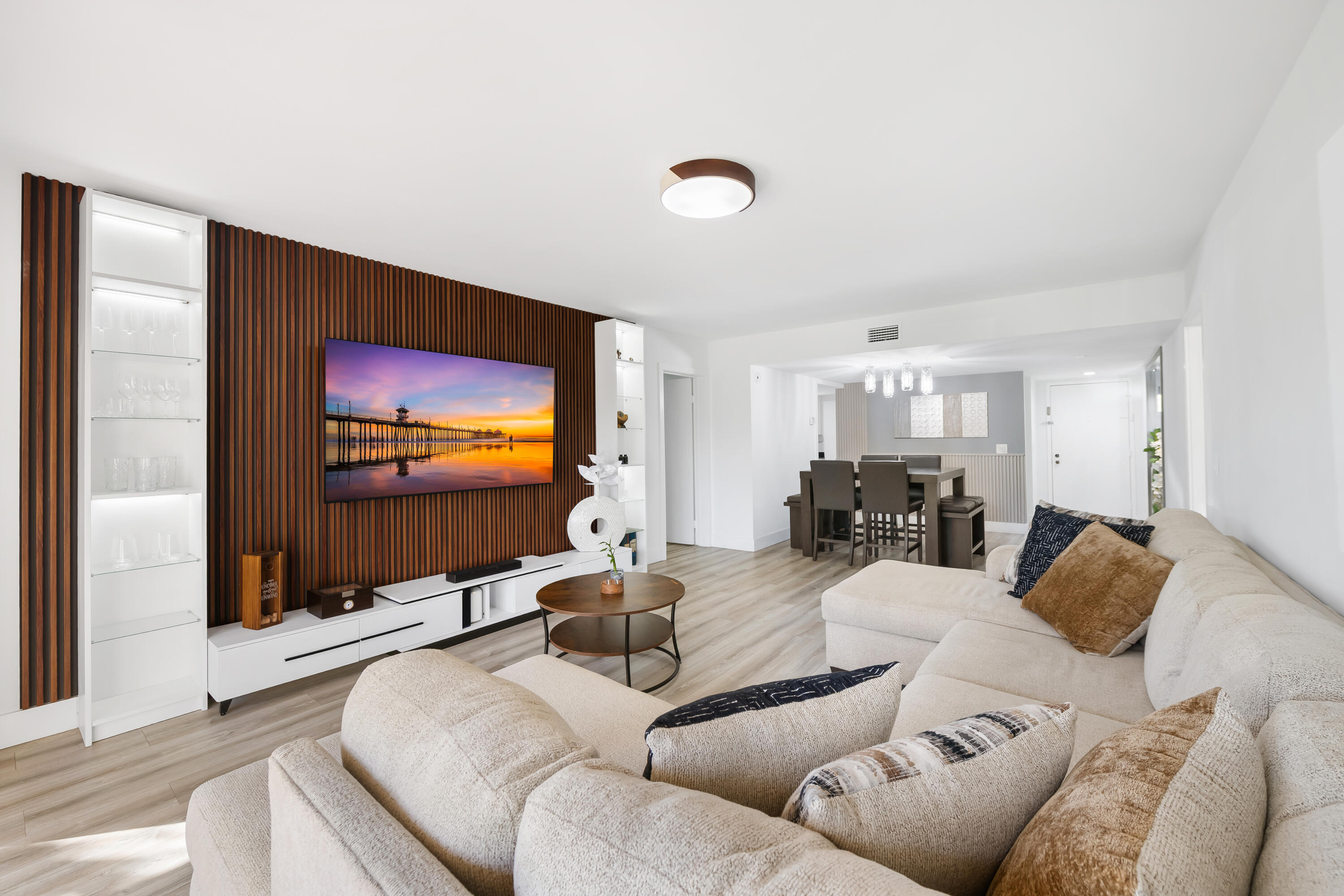 *Seller is willing to discuss a 2-1 interest rate buy-down, allowing the buyer to benefit from a reduced interest rate and lower monthly payments for the first two years of the loan- An incredible opportunity in today's market!*  This is a fully renovated condo showcasing sophisticated modern elegance. The living room features a striking slatted media wall with matching focal details in the entryway and dining room. Three updated bathrooms add a fresh, streamlined touch. Bright accents of the kitchen flow seamlessly into the living room, a contemporary space perfect for entertaining. Enjoy a spacious screened-in patio ideal for outdoor relaxation.  Includes membership to Bonaventure Town Center Club with many amenities: fitness rooms, heated pools, sauna, tennis, bowling, basketball, racquetball, mini golf, game room, theater, playground and more. Maintenance covers water, cable, high speed internet, trash and insurance. In-unit washer/dryer, assigned parking, passed inspection and strong reserves! A-rated schools! Club hours:  Monday-Friday: 6 AM - 10 PM  Saturday: 7 AM - 9 PM  Sunday: 7 AM-6PM. Rental restriction - Must own for 2 years. Pets are welcome! All information herein is deemed accurate but subject to errors and omissions. Buyers to verify all information.
