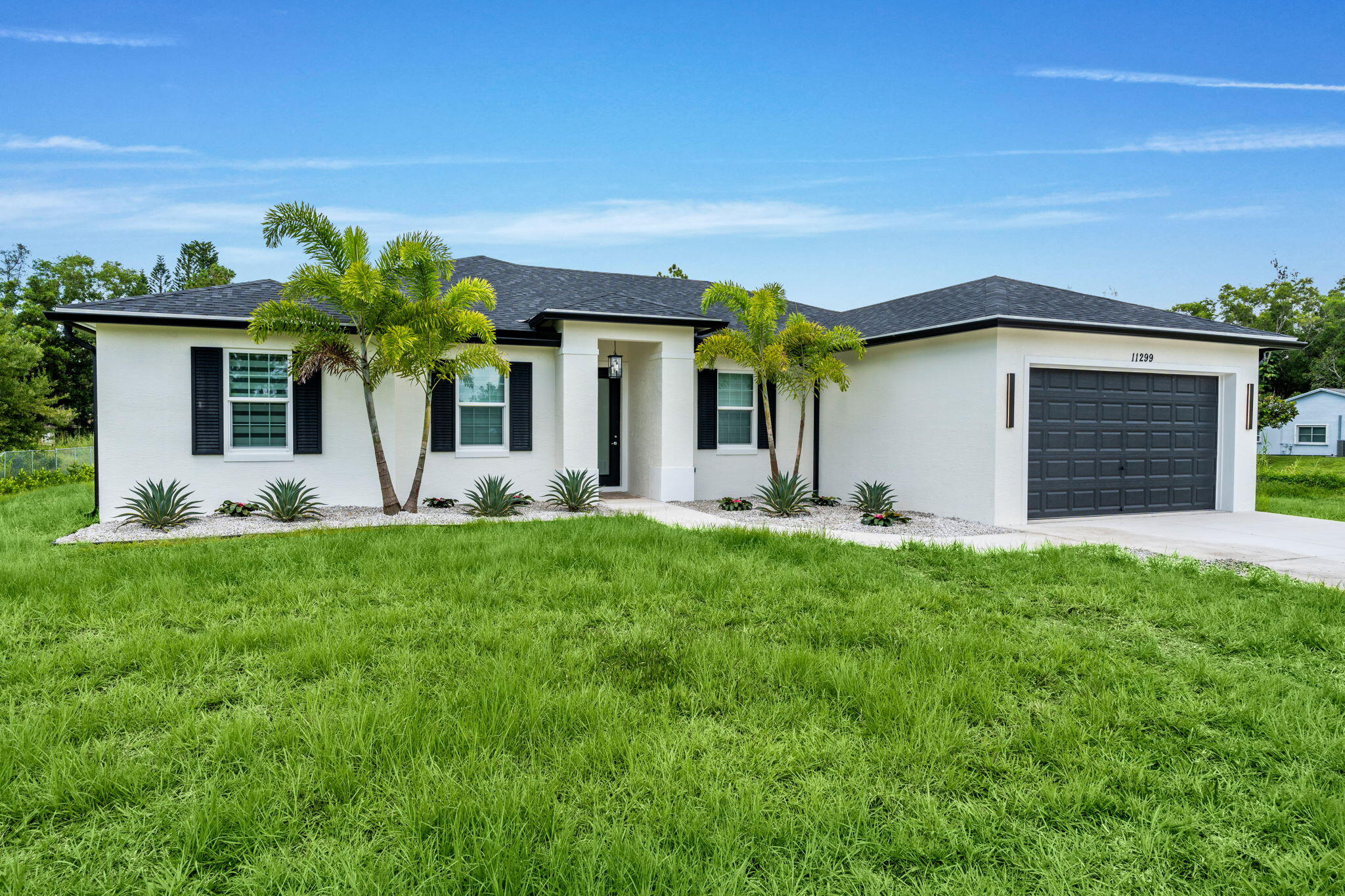BRAND NEW CONSTRUCTION (2026) with NO HOA! Be the first to live in this energy-efficient 4-bedroom + den, 3-bath home featuring Gordon Ramsay by THOR Kitchen stainless steel appliances, granite countertops, custom cabinetry, soaring ceilings, Low-E impact windows and doors, designer finishes, and a covered patio. Situated on a private, fully fenced canal-front lot with ample parking for RVs, boats, and horse trailers. Offered unfurnished for annual rental, with a furnished option available for seasonal rentals only. Some photos are virtually staged. A private pool is planned after occupancy; construction (estimated 3-6 months) will be fully fenced to help minimize disruption. Available for seasonal, off-season, or annual rental.
