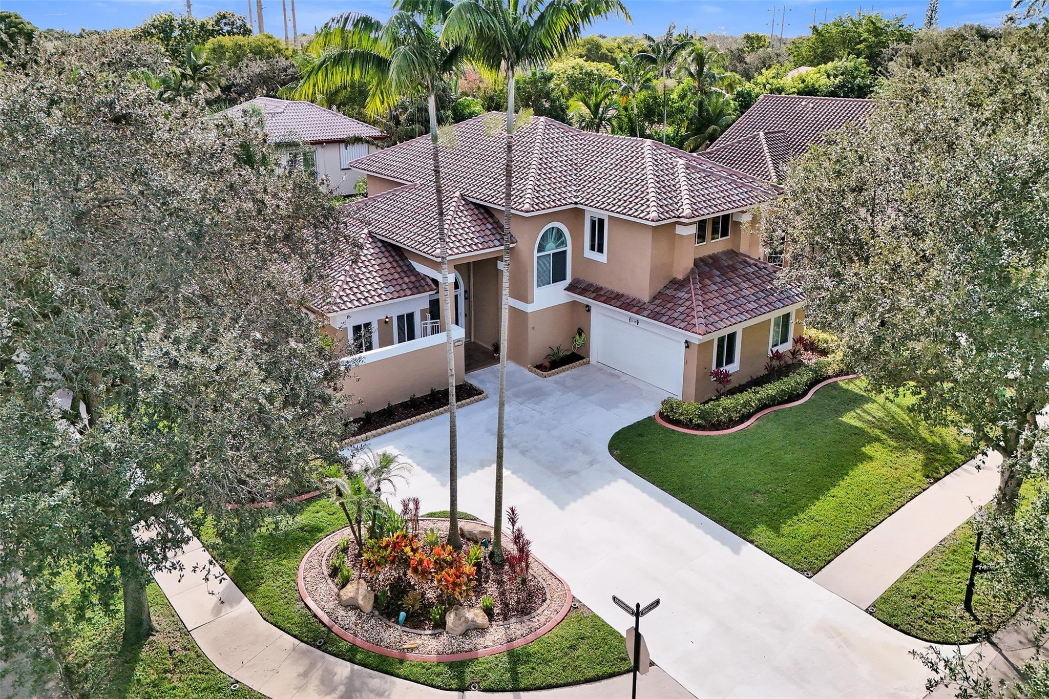 Welcome to East Landing in the gated Rock Creek community of Cooper City — tree-lined, walkable, quiet streets. This 5-bedroom, 3.5-bath corner-lot home offers 3,506 sq ft of flexible living built for how people actually live today. A first-floor bedroom with a full bath creates a versatile space — guest suite, private home office, or comfortable multigenerational living — while a separate downstairs half bath keeps the main areas entertaining-ready. Upstairs, the primary suite opens to a private balcony. Volume ceilings, multiple living zones, and a bright, open feel throughout. The fenced corner lot and oversized driveway handle everyday parking and storage. The expensive items are already done: 2025 roof, full impact windows and doors, and a complete repipe — improvements that should qualify for significant wind mitigation insurance credits and take real items off the inspection list. A/C air handlers were replaced in approximately 2023. Move-in ready. Rock Creek is the lifestyle — minutes to Cooper City schools, parks, and sports complexes, with quick access to I-75, the Turnpike, and west Broward. Square footage and an insurance profile this clean don't sit long here. Come see it.