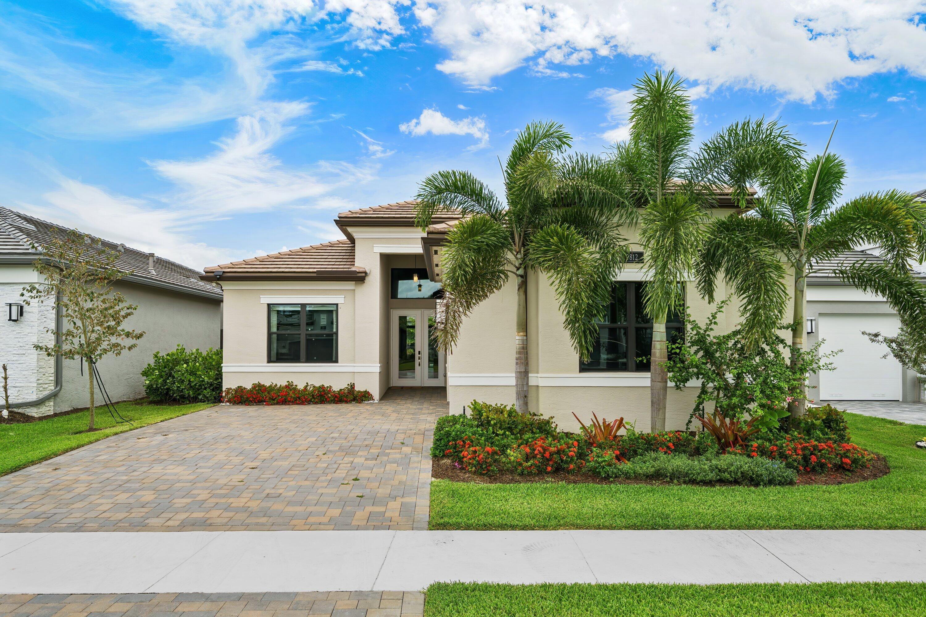 Magnificently appointed and designer decorated Venice model in Valencia Grand with 4 bedrooms, 3.5 bathrooms, and a hobby room. This one-of-a-kind home is decorated with high end, stunning finishes throughout. Engineered hardwood floors, chef's kitchen, extraordinary lighting, built-ins, bars, custom closets, wallpaper, custom saltwater heated pool, spa, outdoor kitchen, full house generator, and so much more. Resort-style amenities include clubhouse, patio bar and restaurant 6 Har-Tru tennis courts, indoor and outdoor pickleball, bocce ball, multiple pools, state-of-the-art fitness center, fitness studio with classes, spa, salon, card rooms, social activities for everyone!