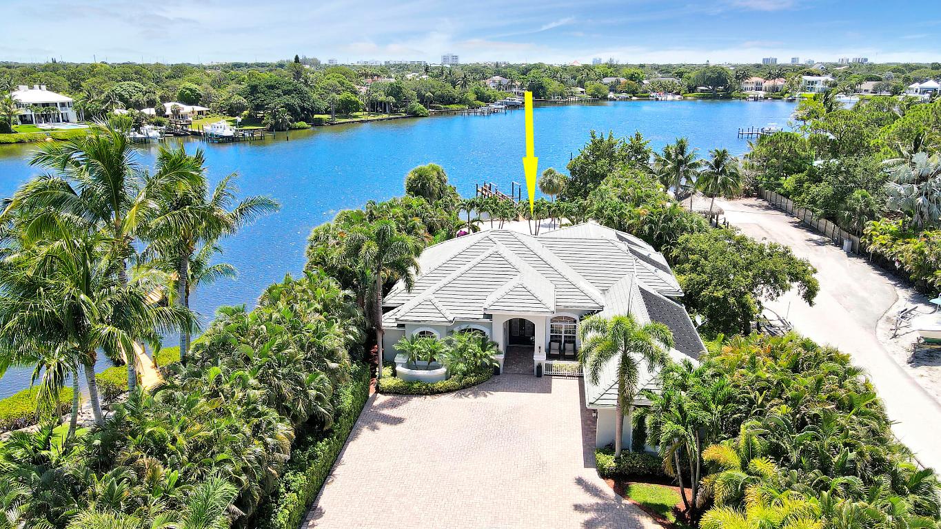 Welcome to 19560 Gulfstream Drive, a distinguished waterfront estate in Jupiter, FL, where luxury seamlessly blends with tranquility. This luxury estate boasts wide water views on a substantial 1.2-acre waterfront lot, complete with a rare private beach with 100 ft of water frontage. Located in the unincorporated area of Jupiter/Tequesta, it offers the advantage of dealing solely with Palm Beach County for approvals. The lot's depth provides numerous opportunities, including a guest house, sport courts, or a summer kitchen.
This remarkable property spans 3,753 sq ft on a private lot with 100 ft of water frontage, offering stunning views and serene living. The residence includes 5 bedrooms & 3.5 bathrooms, with a versatile fifth bedroom perfect for an office or in-law suite, CLICK MORE catering to multi-generational needs.
The estate is equipped with a whole house generator, ensuring uninterrupted comfort and security. Experience the quintessential Florida lifestyle with a heated and chilled saltwater pool, spa, and private beach, all nestled within lush tropical surroundings. The expansive patio and brick paver pool deck provide generous space for outdoor gatherings, while the dock with boat lift offers seamless ocean access.
Inside, the home exudes elegance with soaring coffered ceilings, crown molding, and polished travertine floors. The chef's kitchen is a culinary haven, featuring granite countertops, a kitchen island, and a coffee or wet bar. Impact doors and windows provide peace of mind, complemented by custom blinds for added sophistication.
Designed with privacy in mind, the estate is set over 600 feet from Gulfstream Drive, featuring a brick paver driveway. The vast lot offers potential for a guest house, pickleball, or tennis courts. The family room, with coffered ceilings, water views, and a fireplace, promises cozy evenings during Florida's mild winters.
Key features include a 50-year cement tile roof, a resurfaced and retiled pool in 2023 with solar heater and chiller, a whole house generator from 2013, updated water treatment, and recent HVAC systems. The fifth bedroom and one garage bay have been converted into a spacious office with French doors.
Don't miss the chance to explore this property. Experience unparalleled waterfront living at 19560 Gulfstream Drive, where every detail is crafted for your enjoyment. Showings by appointment only. Bring us an offer!