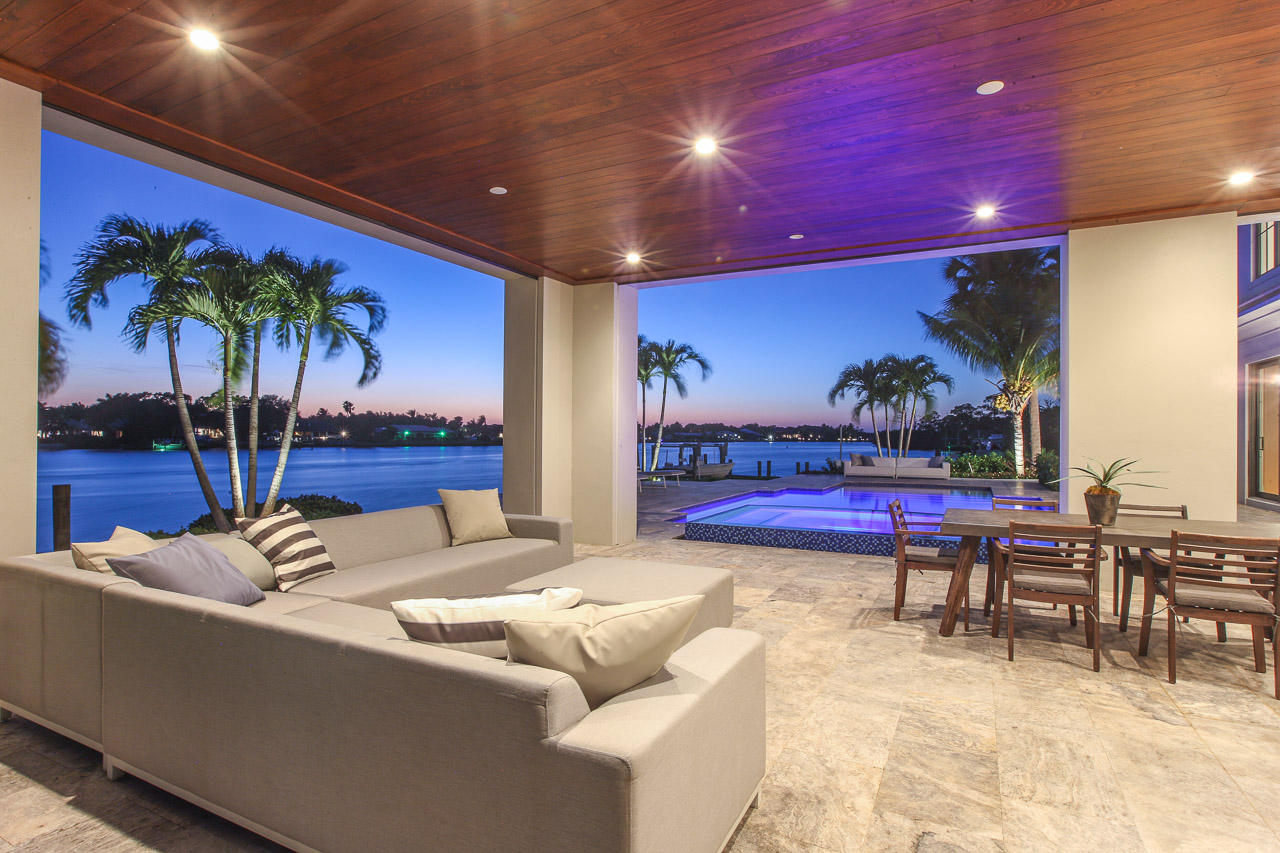 Magnificent new construction custom home with the best of everything. Wide river views on the Loxahatchee river, The finest of craftsmanship and materials. 5 bedrooms, master suite on 1st floor, gourmet kitchen with concrete counter tops, top of the line appliances, 2 laundry rooms, wine cellar, elevator, impact glass, 12 x 17 walk in hers master closet, woods and stone floors, upstairs media room that walks out to huge covered lanai. The home opens up to reveal the resort style pool and patio, summer kitchen with bar combined with the cool river breeze makes living a paradise!  Owner will consider owner financing under certain circumstances.