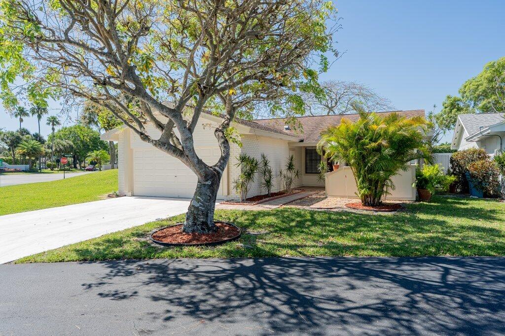A beautiful well maintained, corner lot, 4-bed, 2-bath, 2-car garage single family home located in Boynton Lakes, one of the most desirable communities in Boynton Beach. The house is located in a corner lot, right at the entrance of the street and features a bright, open layout, white kitchen cabinets, brand new stainless-steel appliances, tile and wood floors throughout the entire house, brand new blinds, nice landscape and the exterior was recently painted. The house includes 4 large bedrooms, a nice size side-yard with no homes in the back which provides a great feel of privacy and tranquility. This family oriented community is close to the Mall, Movies, parks, dining and all major highways. Seller is willing to give credit towards a new roof, AC and water heater. Can't beat that!