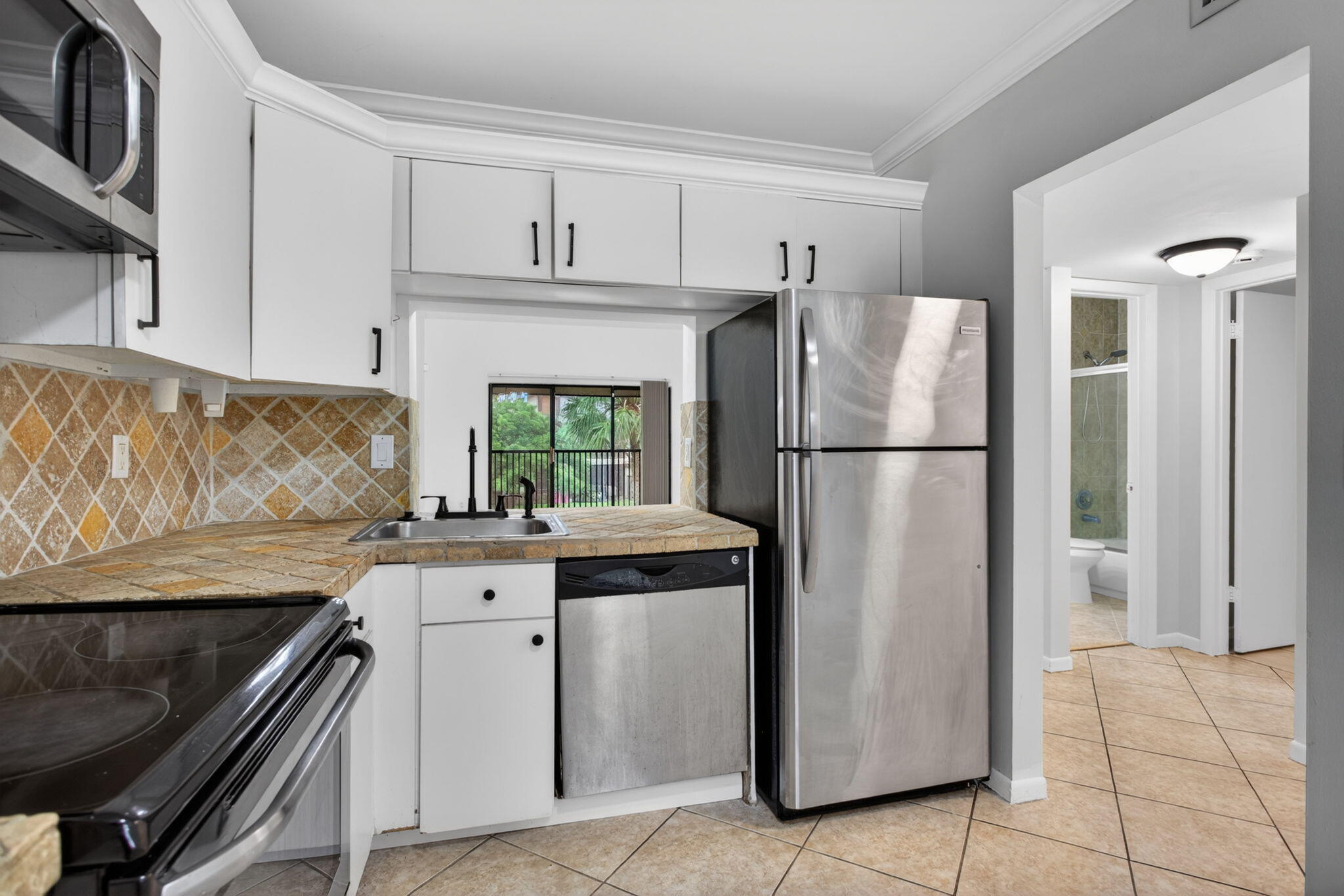 Welcome to this charming two-bedroom, two-bathroom condominium located in Karanda Village II-B in Coconut Creek, Florida. This two-story home offers 1,079 square feet of thoughtfully designed living space, providing comfortable proportions for modern living. The well-appointed floor plan features two full bathrooms, ensuring convenience for residents and guests alike. Situated within the established Karanda Village II-B community, this condo presents an accessible opportunity to own in this established Coconut Creek location. Whether you're seeking a practical residence or an investment property, this condominium offers solid fundamentals and proven value in a polished community setting.