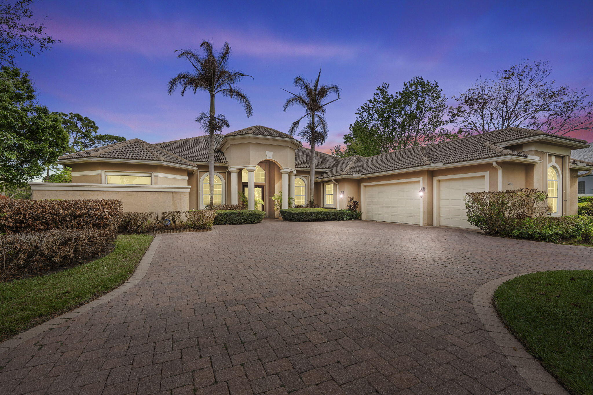 Welcome to luxury golf course living in the prestigious PGA Village. Located in the exclusive Laurels neighborhood, this custom estate offers 4 bedrooms, 4 baths, a private office & private Gym with approximately 3,977 sq ft of living space on a .58-acre golf & lake view lot. Built in 2003, the home features a grand circular paver driveway, 3.5-car garage, high ceilings, hardwood & tile flooring, an expansive gourmet kitchen with granite countertops & custom cabinetry. The outdoor living space showcases an oversized screened paver patio with a resort-style pool, spa with waterfalls & whole home generator. PGA Village offers 3 championship golf courses PGA Village Golf Club Wanamaker Course, PGA Village Golf Club Ryder Course, & PGA Village Golf Club Dye Course plus world-class amenities