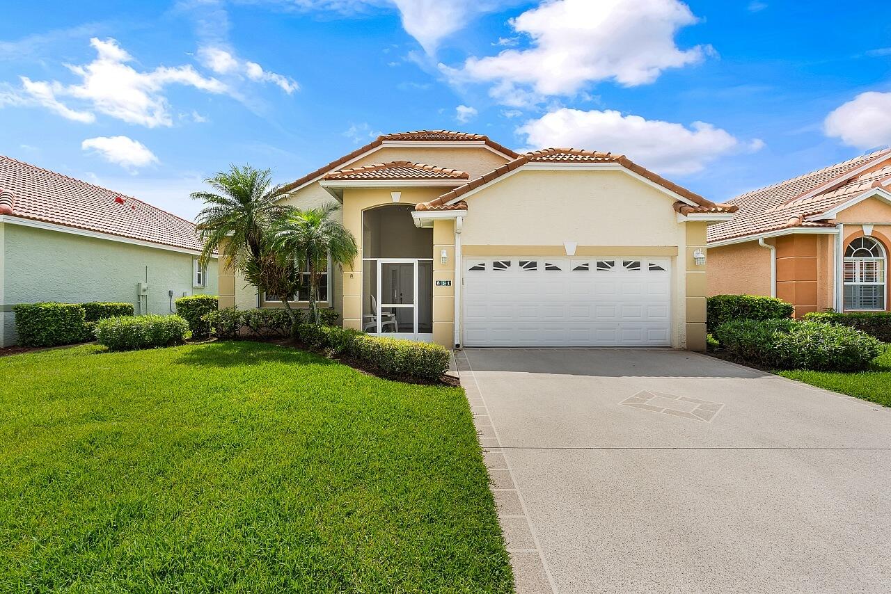 Move into this beautiful 2 bedroom, 2 bath CBS home in desirable Isle of Madeira. Enjoy an open floor plan, updated kitchen with 42" wood cabinets and granite, and renovated bathrooms. Tile and LVP flooring throughout, with carpet only in primary bedroom. Relax on a tiled, screened lanai with peaceful lake views and ideal southern exposure. Additional features are a 2021 barrel tile roof, accordion shutters, screened front porch, and an interior laundry room with extra storage. Kings Isle offers resort-style amenities such as a clubhouse, pool, fitness center, pickleball, tennis, internet, cable, lawn maint and endless social activitie and is located in the heart of St. Lucie West by shopping, dining, and I 95. A well-maintained, move-in-ready gem in a premier active-adult community.